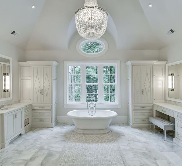Gorgeous master bathroom with multiple layers of lighting.  We love the vanity lights in the mirror, beautiful chandelier and the accent lighting provided by the recessed fixtures.  Oh... and you can&rsquo;t forget the heated marble floor to keep you