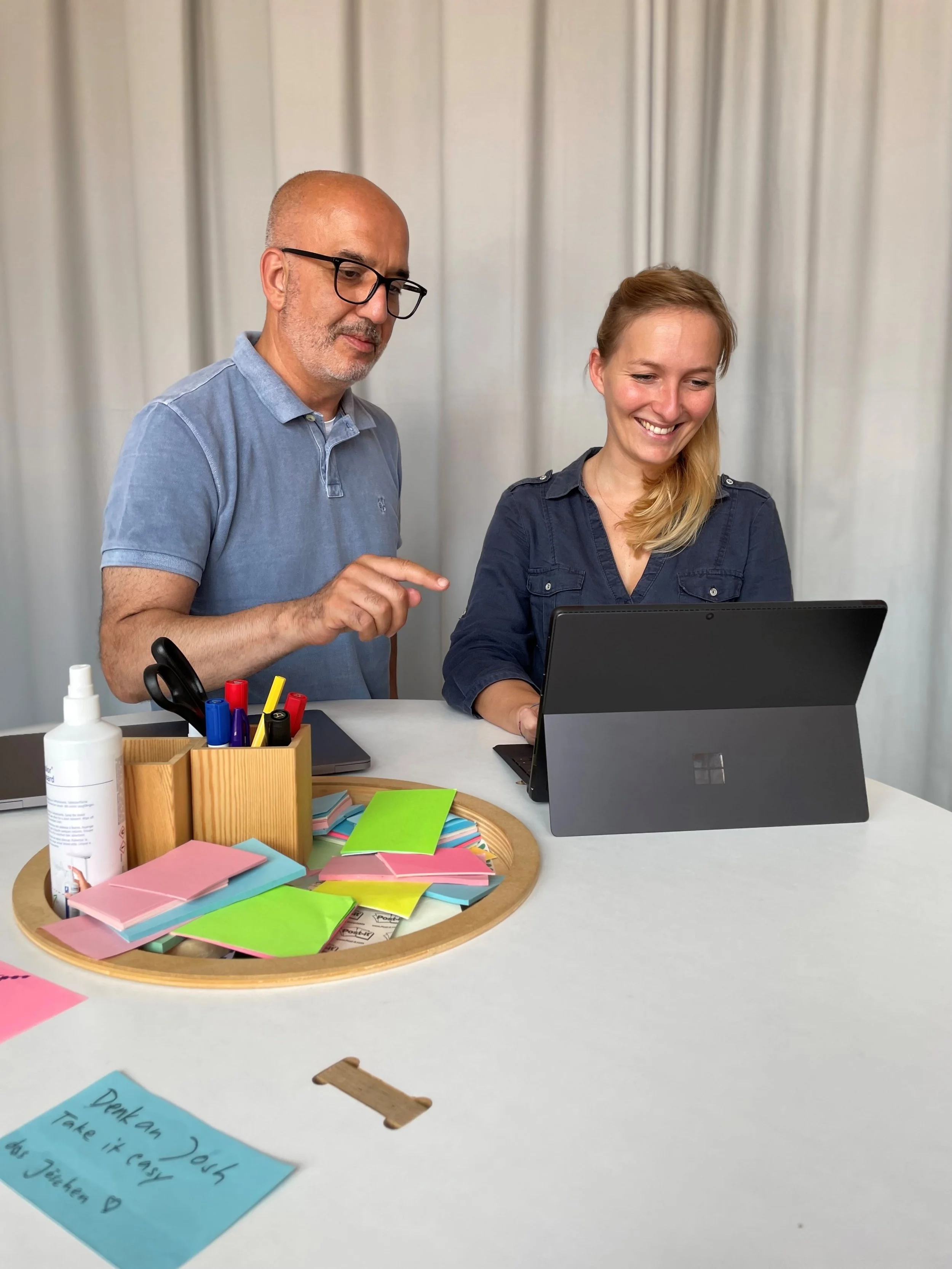 Two people collaborating at work.