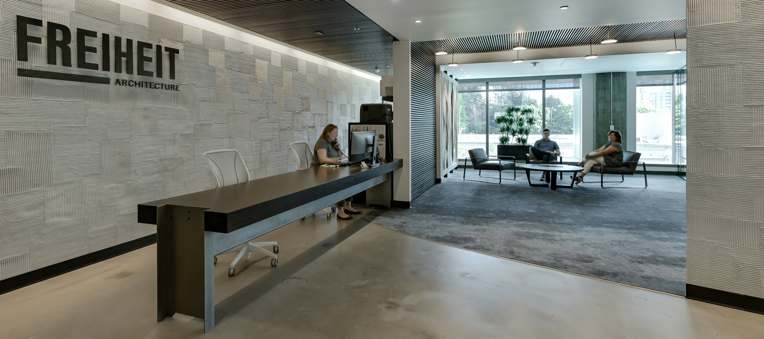 custom reception desk is substantial in size with clean lines