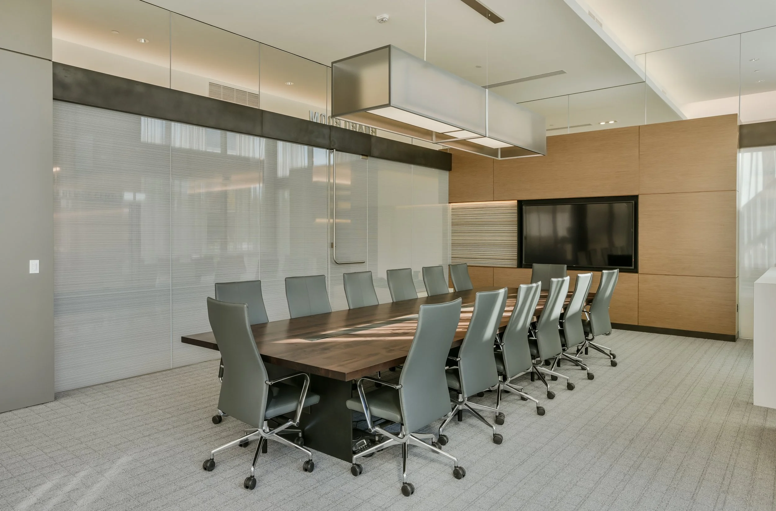 PLANKED SQUARE EDGE MAPLE CONFERENCE TABLE WITH STEEL TROUGH AND POWER MODULES AND CUSTOM STEEL NARA STYLE BASE