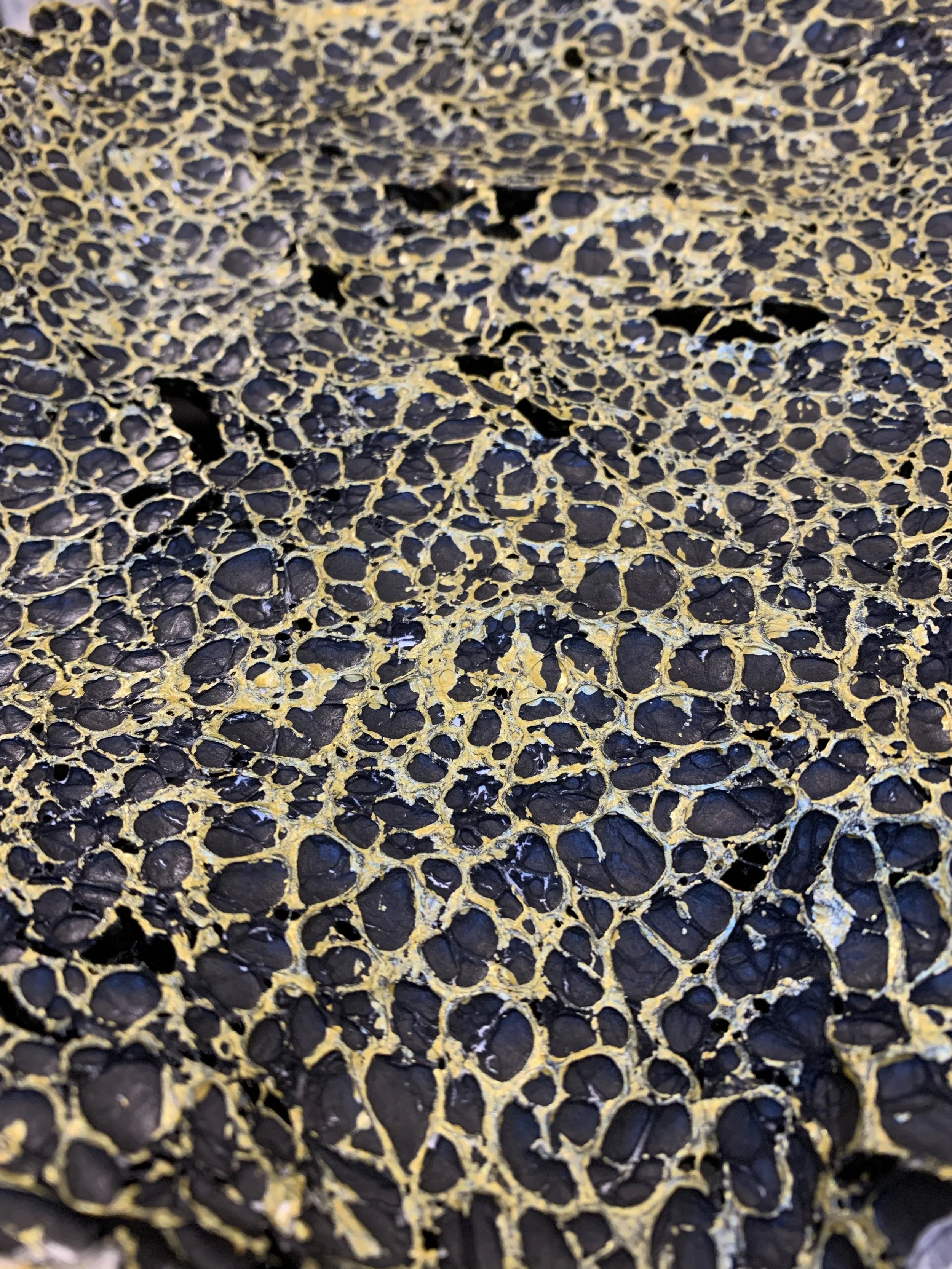 Tyvek paper cubic texture after heat manipulation — reverse side showing different surface effect Frog Aspect art jewelry process Brooklyn