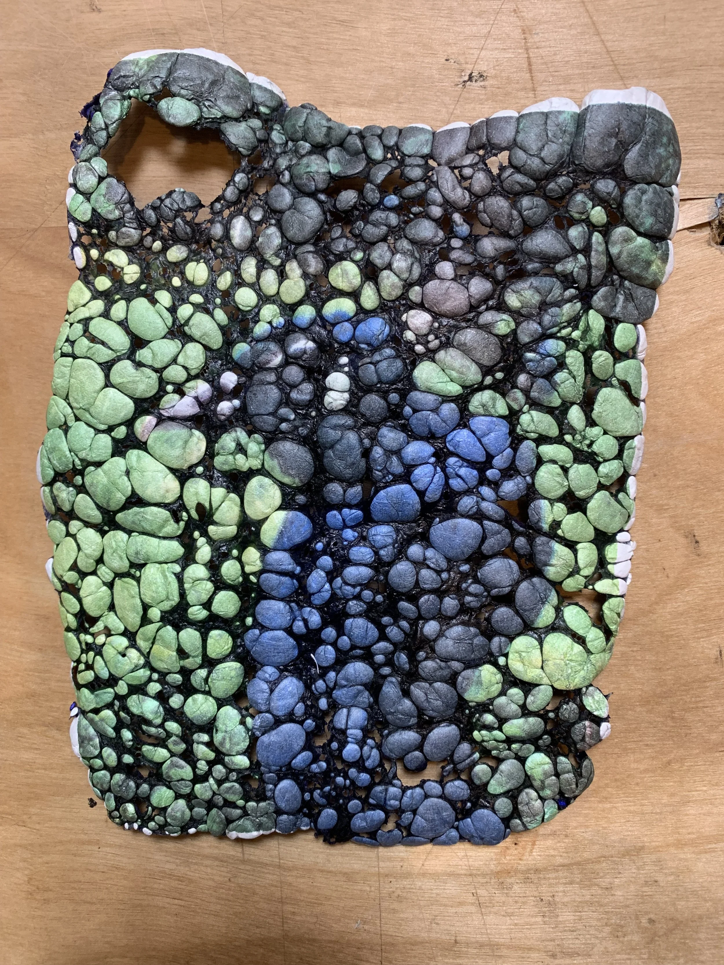 Heat-manipulated Tyvek paper bubble effect first stage of resin jewelry process at Frog Aspect Brooklyn — handmade sculptural art jewelry by Einat Cohen
