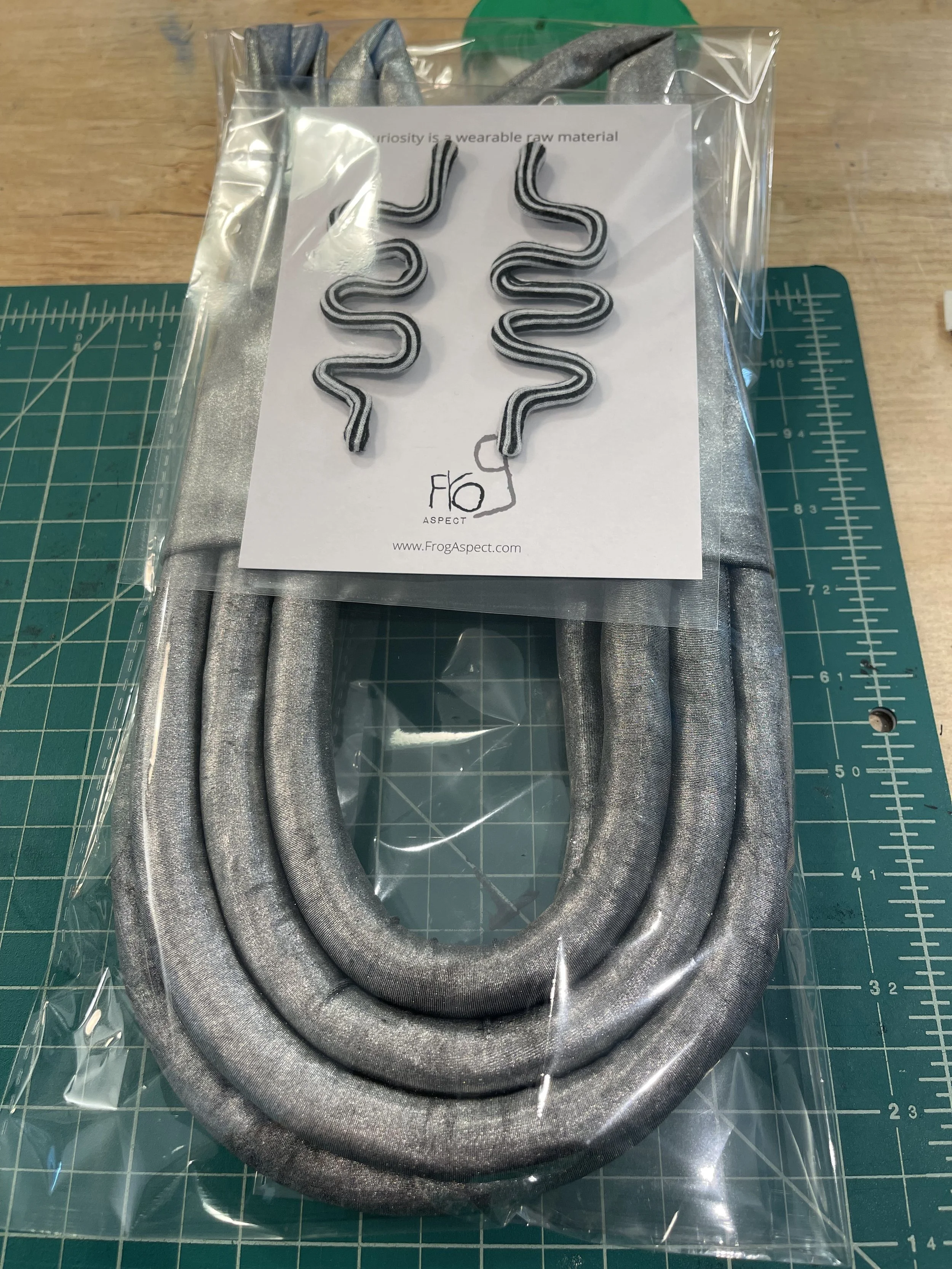 Metallic fabric necklace and striped squiggle earrings by Frog Aspect packaged with branded card — handmade wearable art jewelry Brooklyn