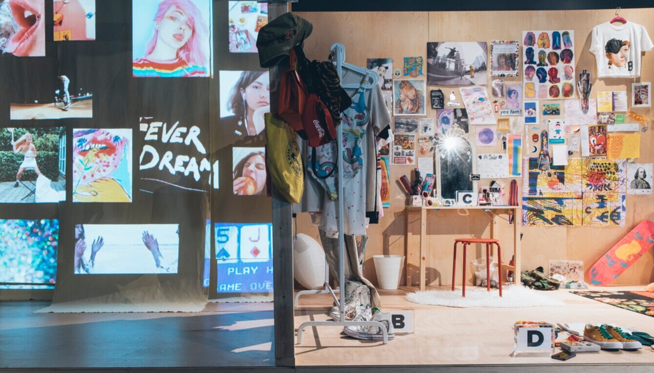 Video’s displayed on the left capturing the mood of who ‘she’ is. A curated rack of apparel and accessories shows the diversity and fluidity of ‘her’ wardrobe. Her wall is decorated with a variety of imagery to portray her personality & her va