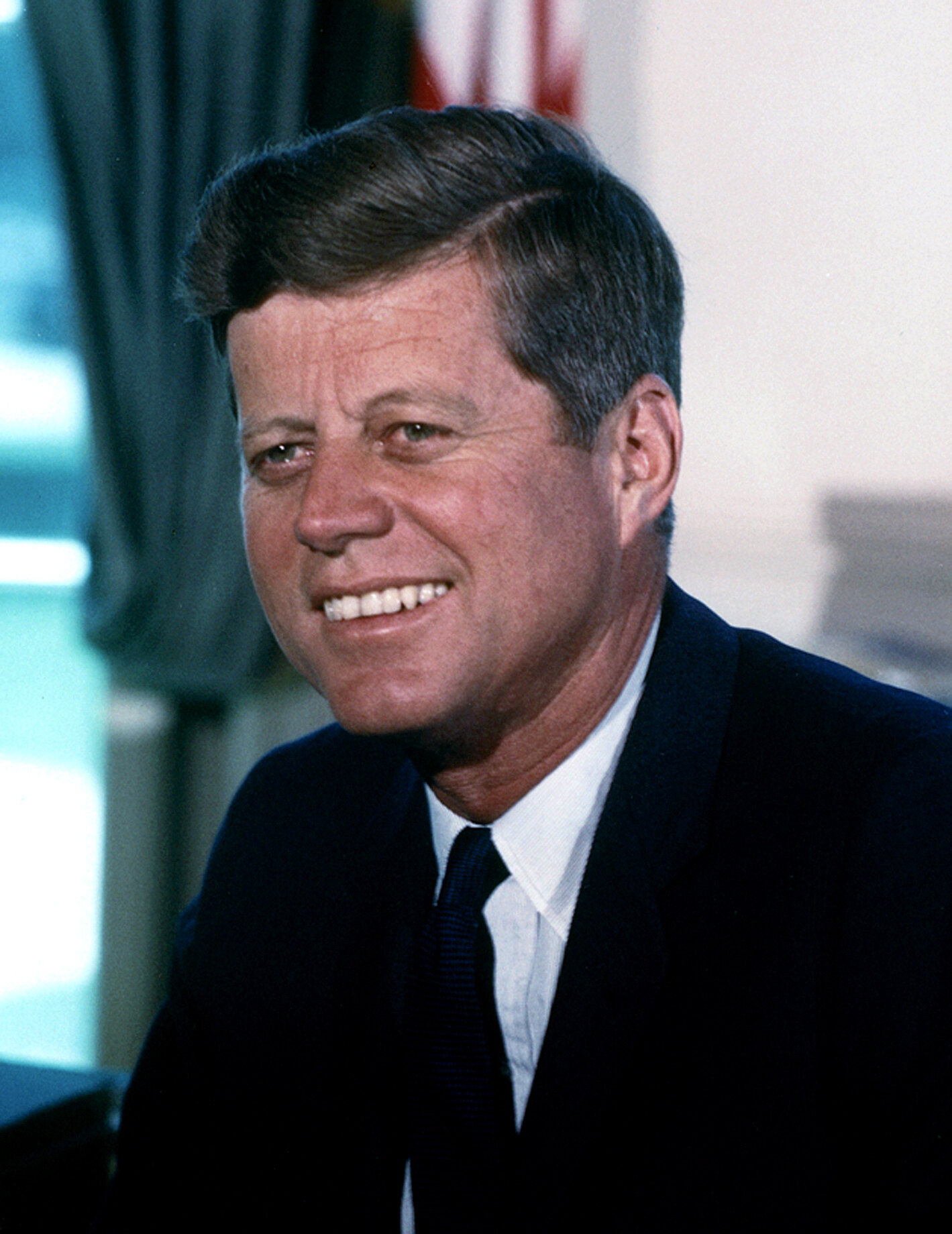 John_F._Kennedy,_White_House_color_photo_portrait.jpg