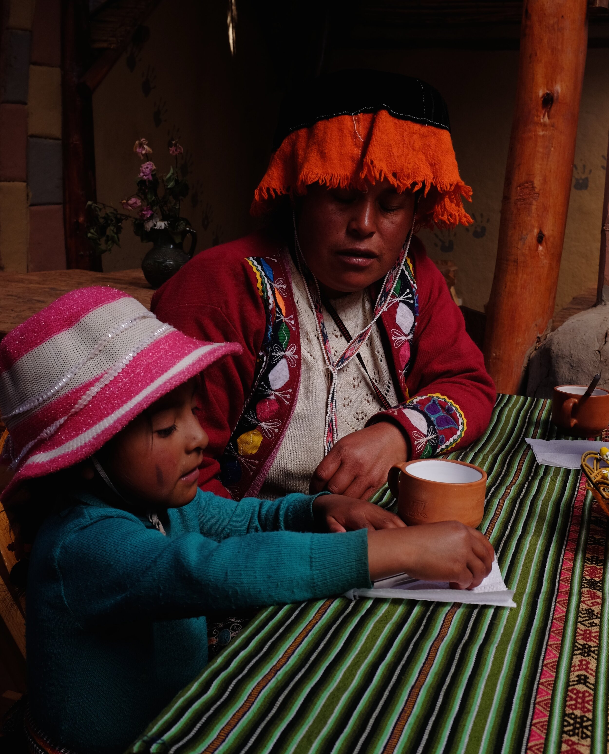 Mother and daughter at lunch, Amaru Village, Andean highlands, Peru