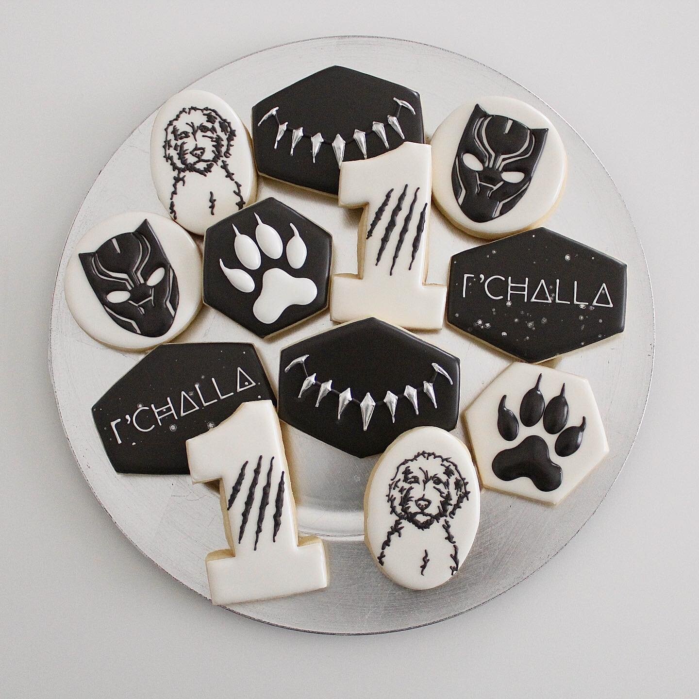 Happy 1st birthday to a sweet 🐶 named after black panther! 🐆 
.
.
.
.
.
.
.
.
.
.
#birthdaycookies #sugarcookies #sugarcookiesofinstagram #blackpanthercookies #dogcookies #utahcustomcookies #slccustomcookies #panthercookies #cookies #royalicingcook
