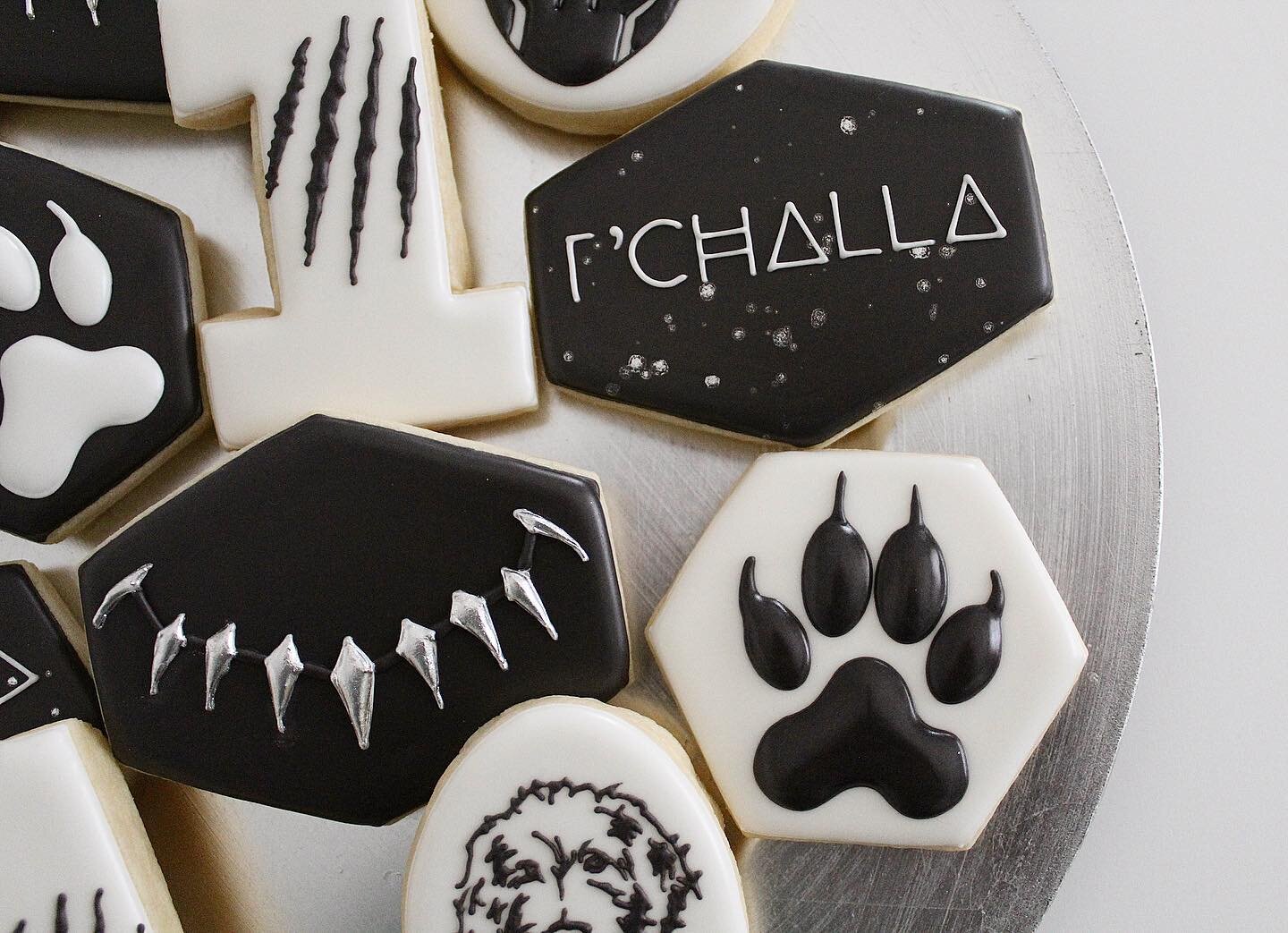 Happy 1st birthday to a sweet 🐶 named after black panther! 🐆 
.
.
.
.
.
.
.
.
.
.
#birthdaycookies #sugarcookies #sugarcookiesofinstagram #blackpanthercookies #dogcookies #utahcustomcookies #slccustomcookies #panthercookies #cookies #royalicingcook