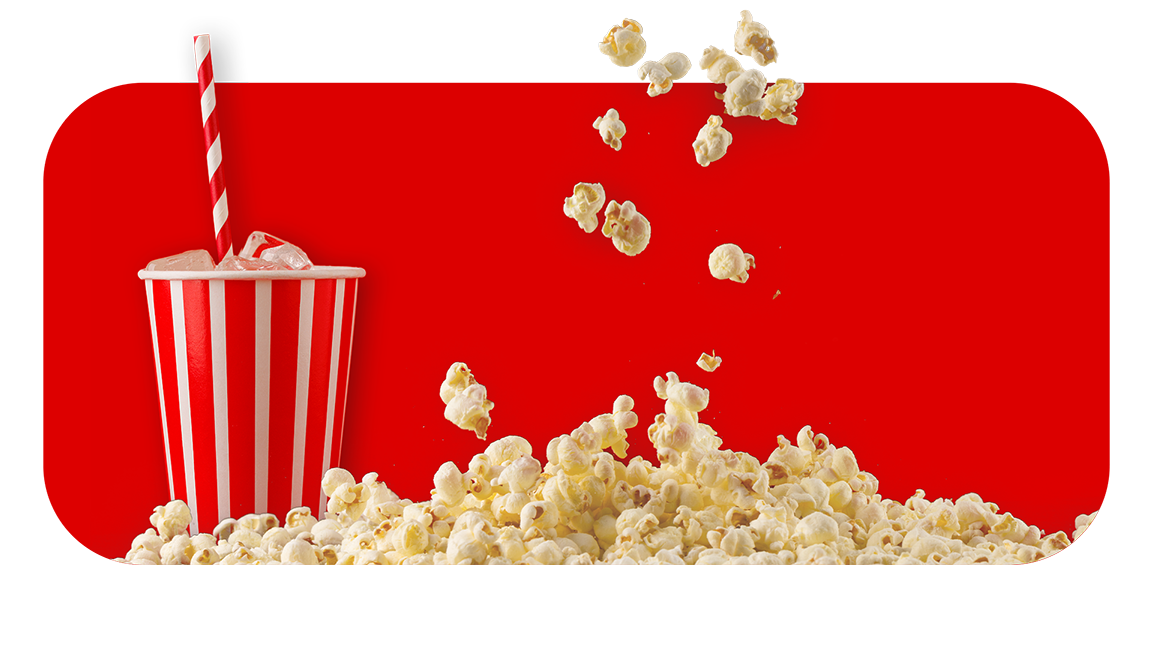A red and white striped popcorn box tipped over with popcorn spilling out, against a bright red background.