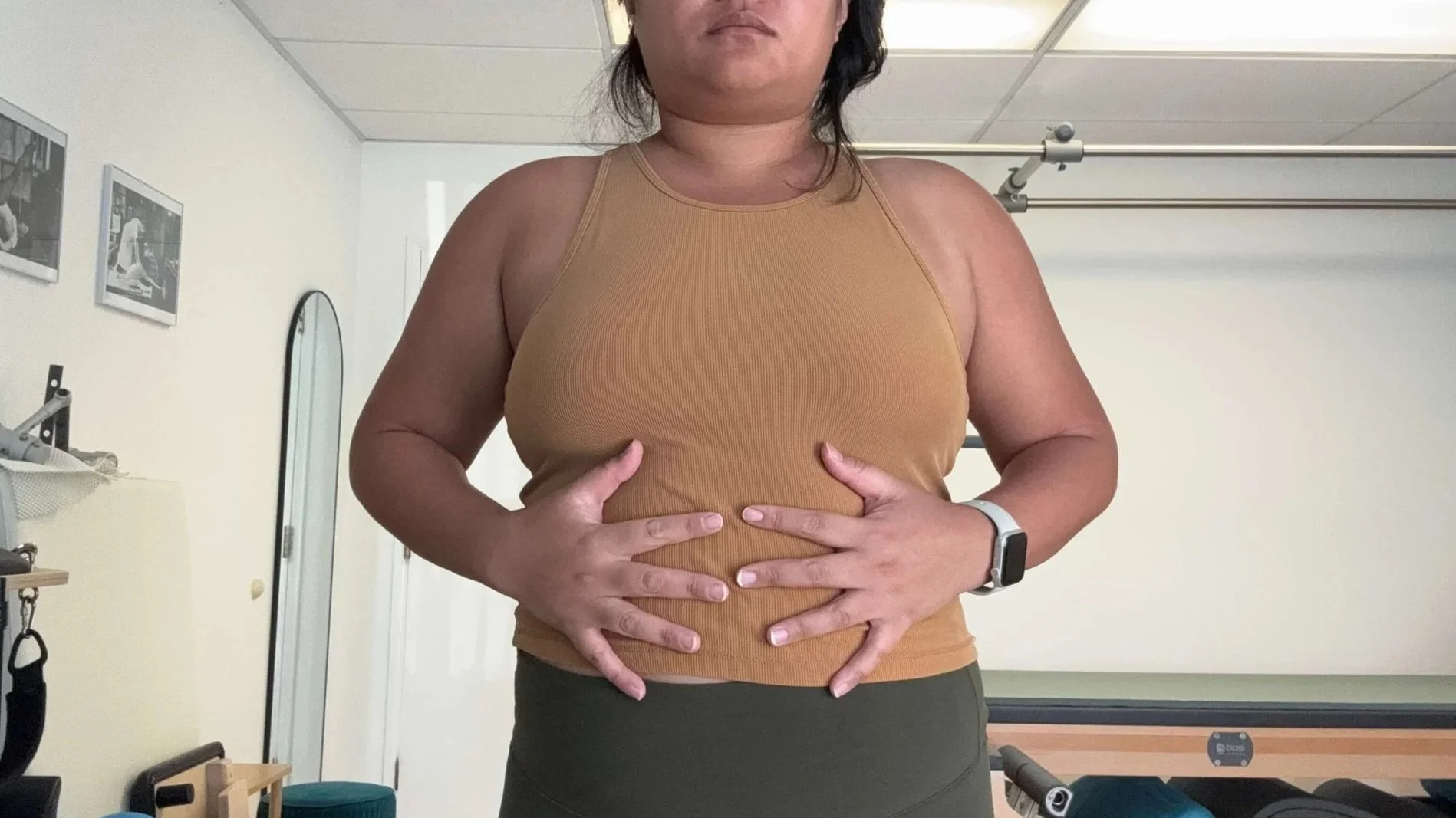 Julie is showing the second position of the 360 breathing exercise