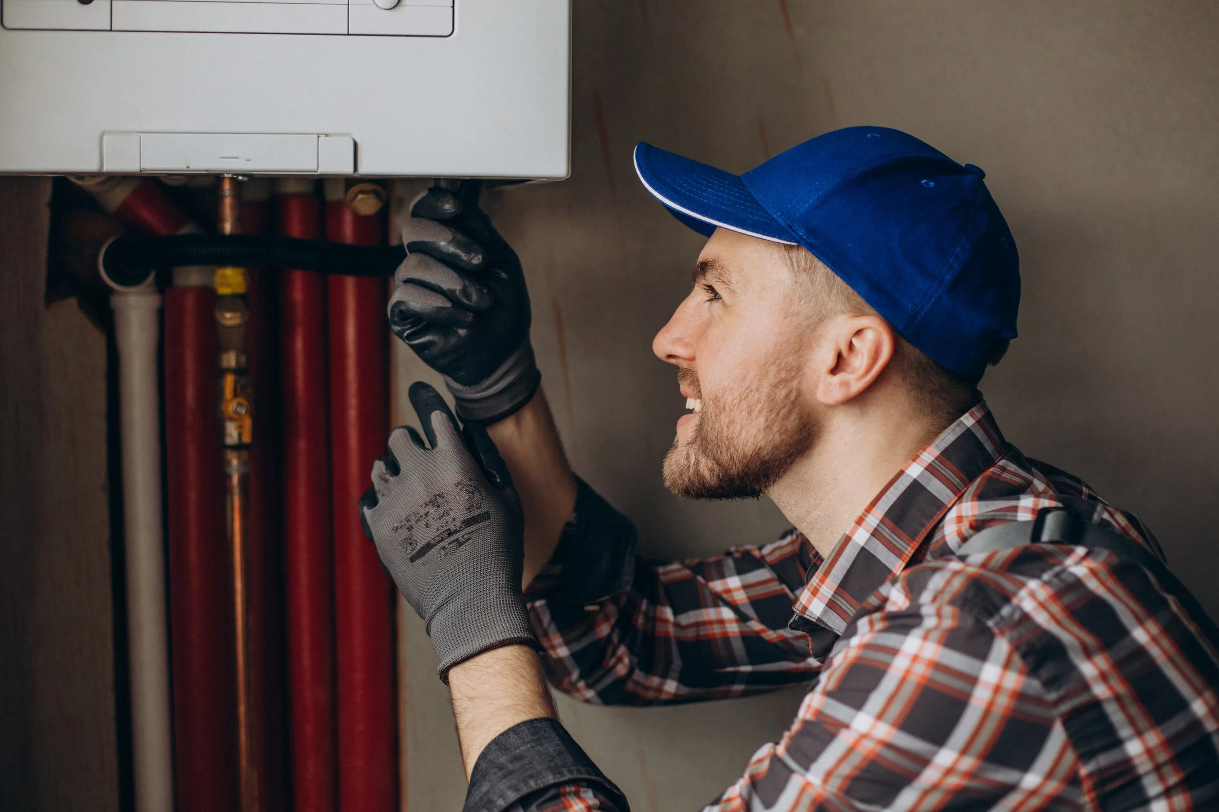 service-man-adjusting-house-heating-system.jpg