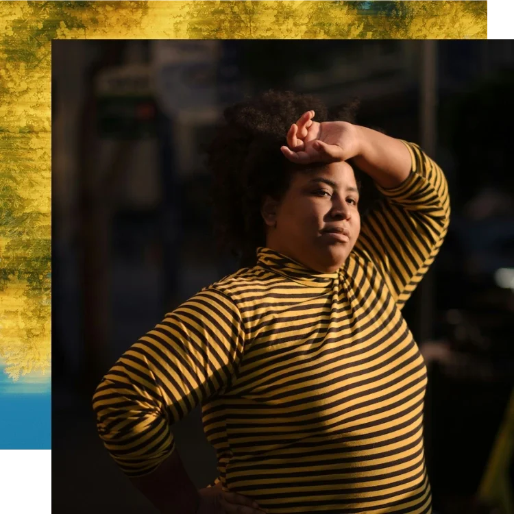 Black person in a yellow turtleneck, hand on forehead, looking reflective in sunlight. Therapy for healing from fatphobia and weight stigma in California.