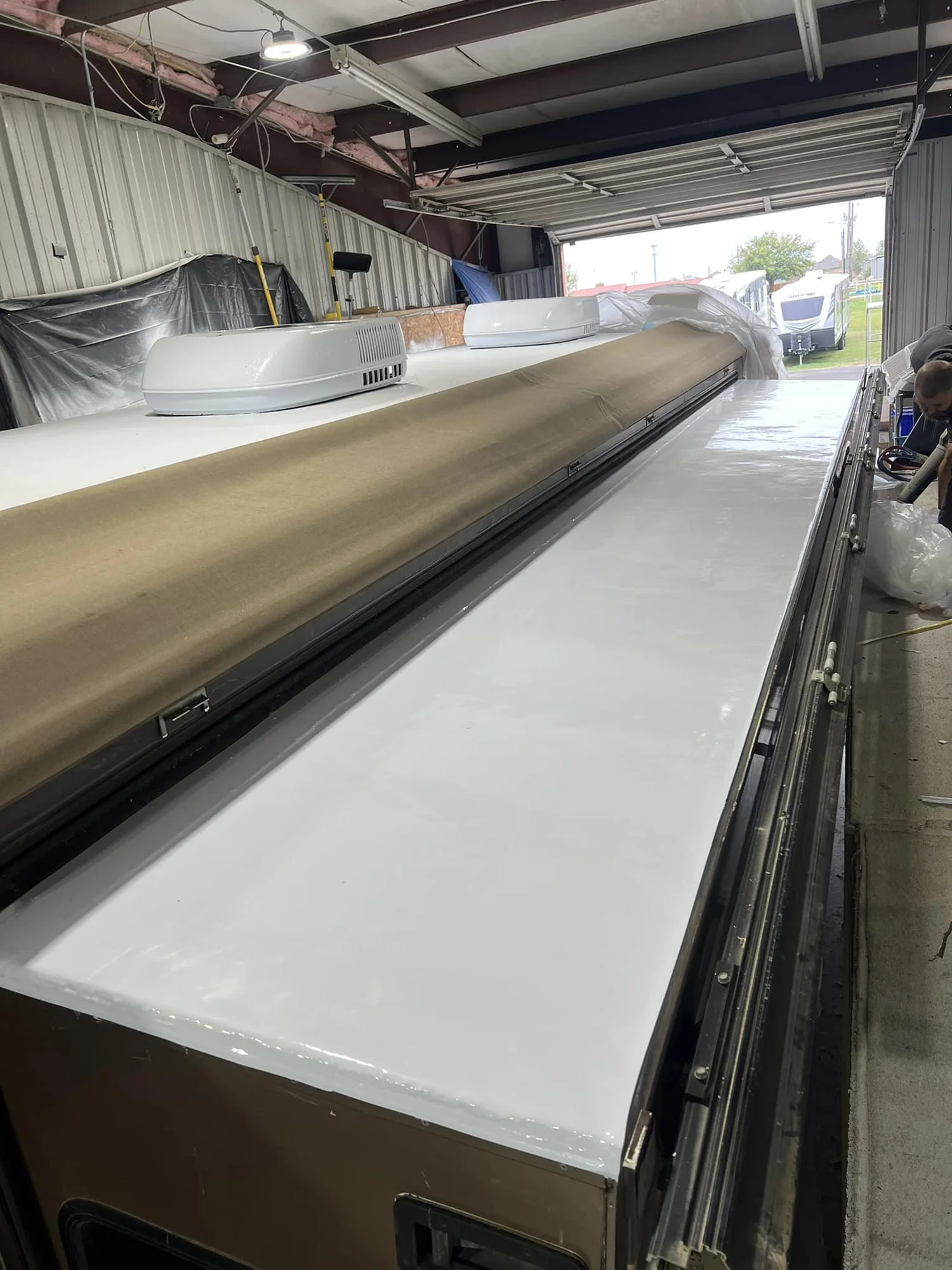 Finished white polyurea RV roof surface