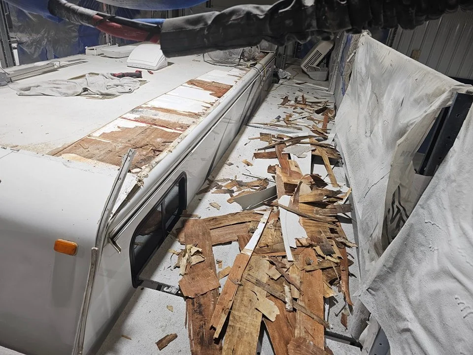 RV roof membrane being removed during roof replacement