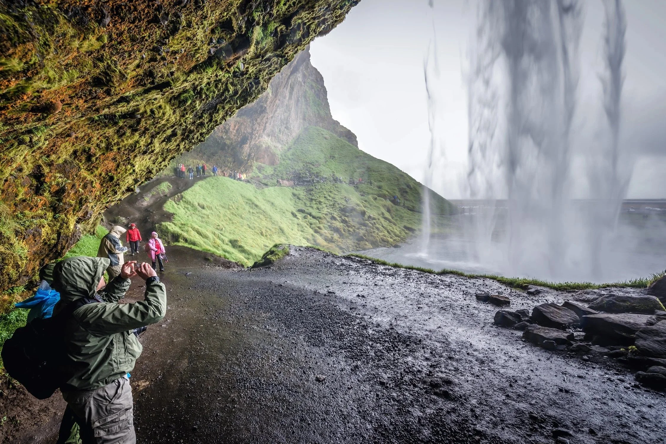 Dreamstime People Behind Seljalandsfoss Waterfall.jpg