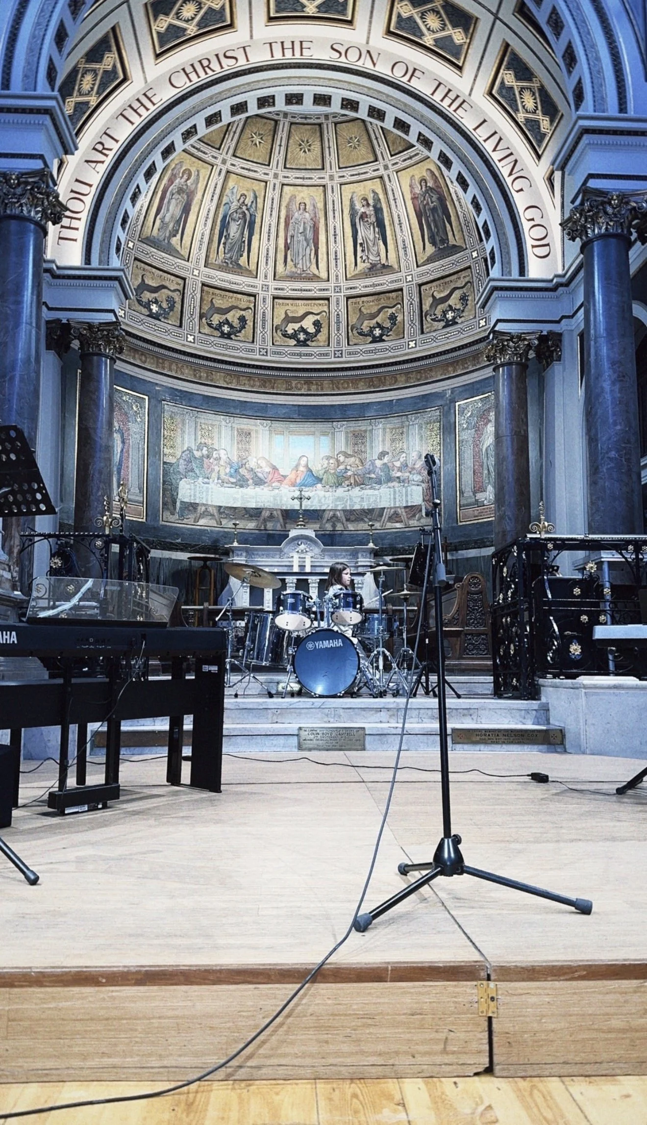 Child drummer performing at a TRM student concert in London, showing performance opportunities and confidence-building music lessons with The Ravljen Method.
