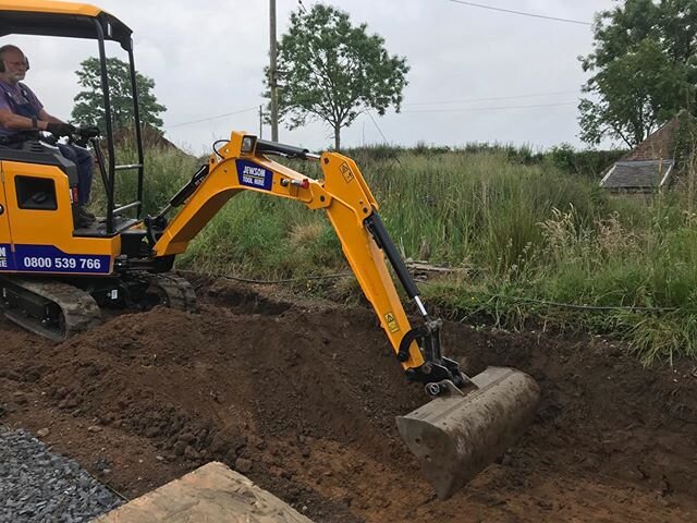 Digging trench for sunken garden area this morning. Low level view over wildlife pond.