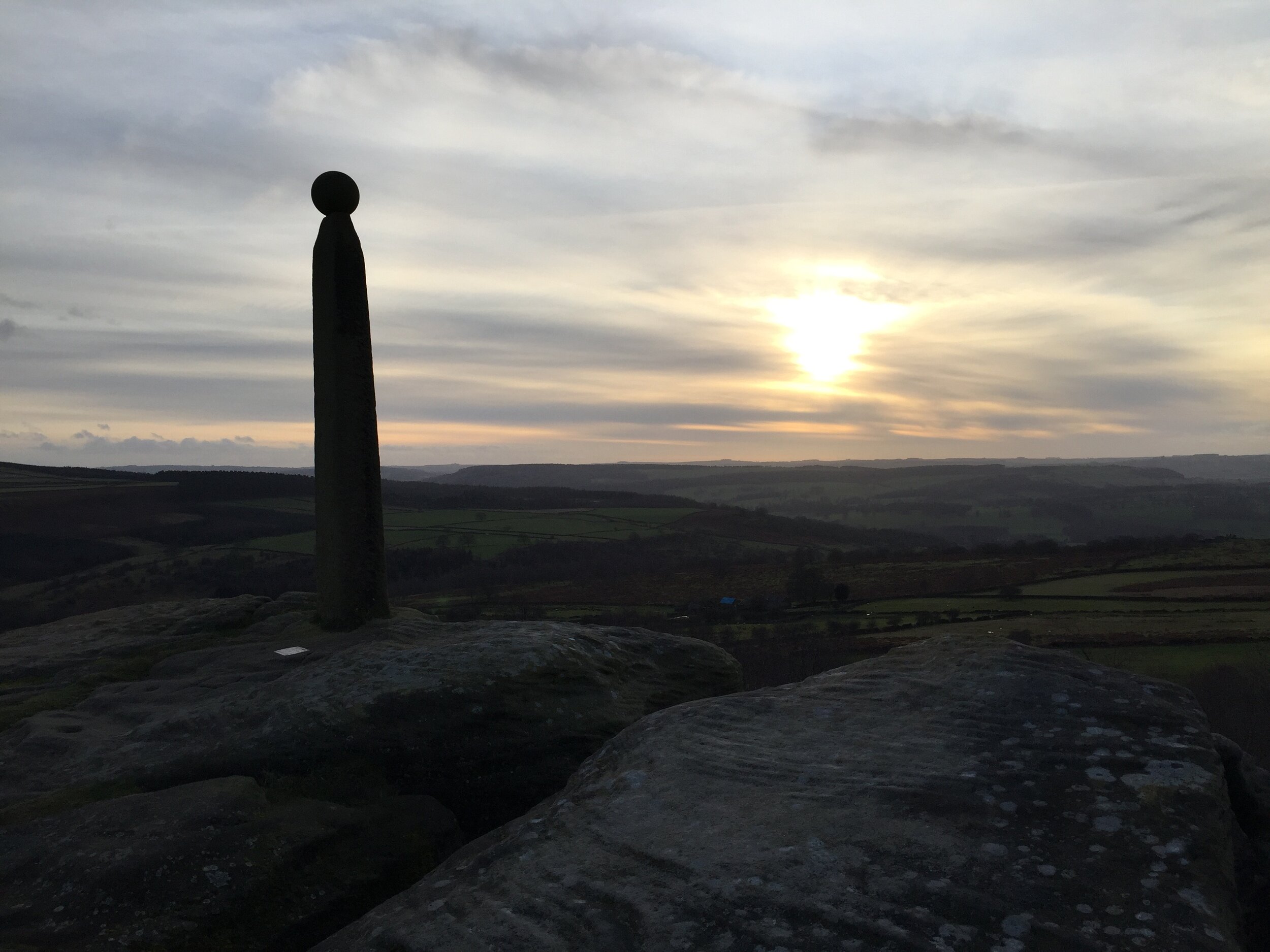 The monument overlooking the Edge, with the beginnings of a sunset in the sky. 