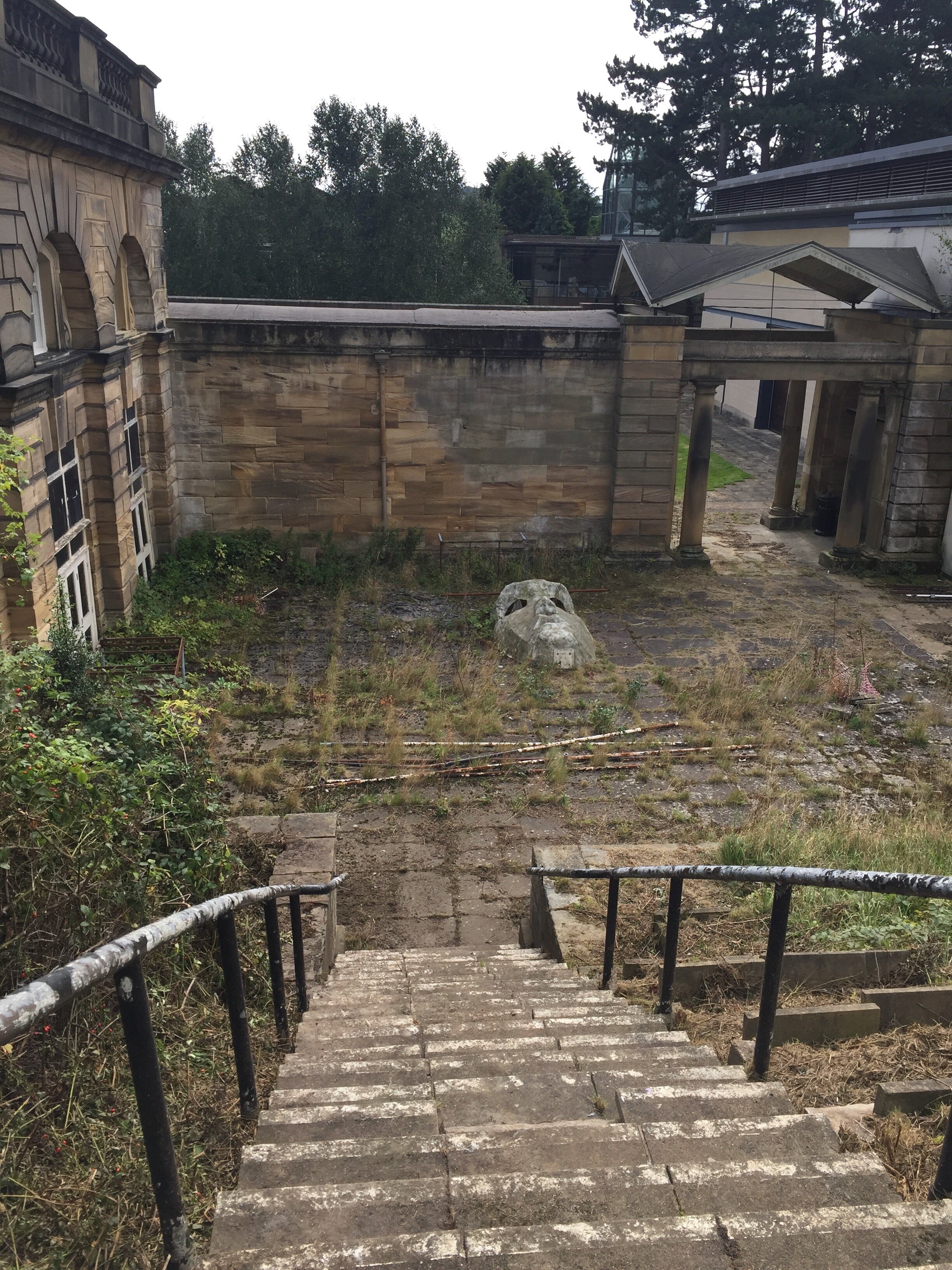  The performance area outside Experimental Theatre. Alongside the steps, the slabs would have formed staged seating on the bank, creating an amphitheatre. The site has been so long abandoned that it seems the signs of early attempts to tend to it hav