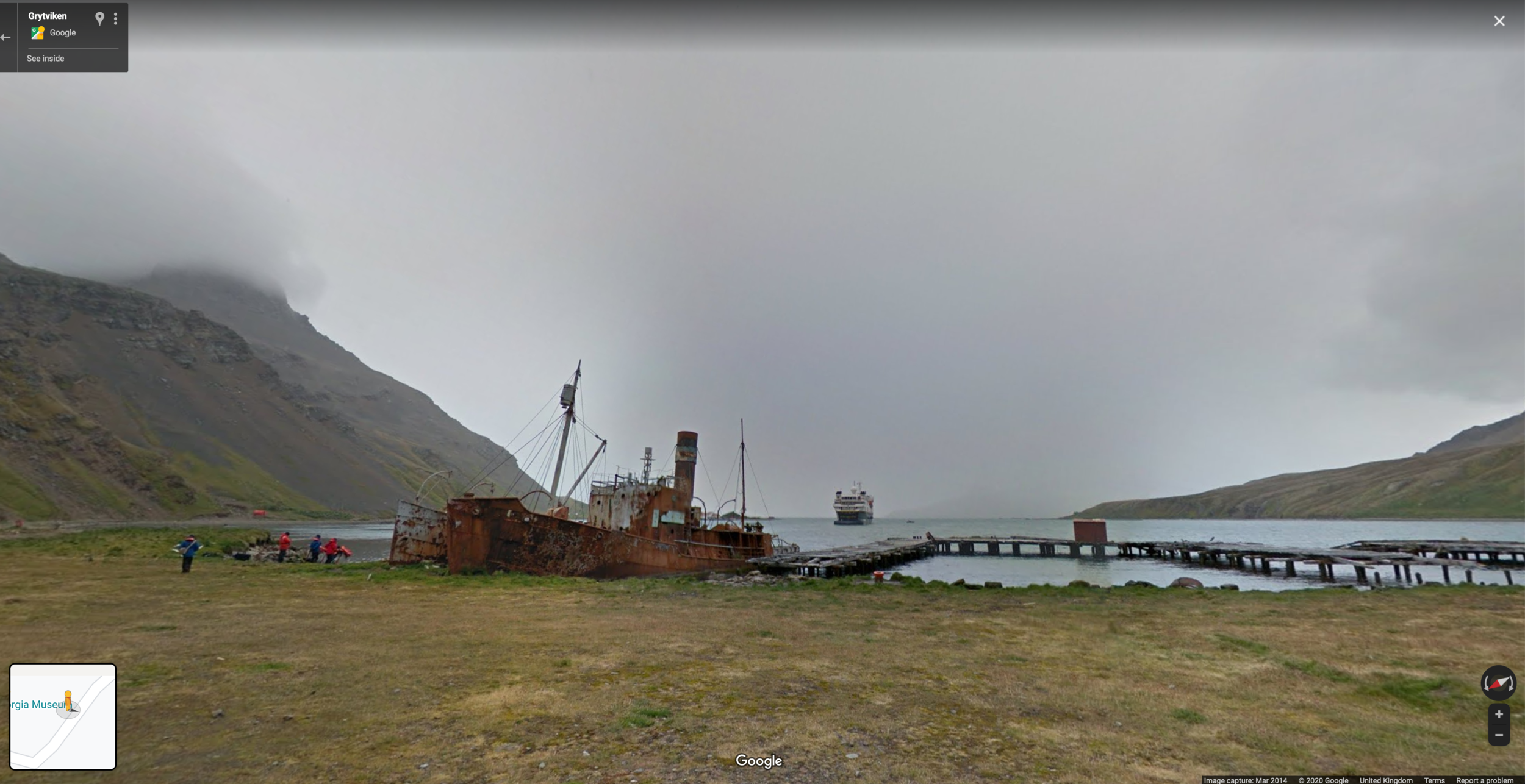  The National Geographic cruise ship, Explorer, waits in Grytviken harbour as older ships rust on the shore. 