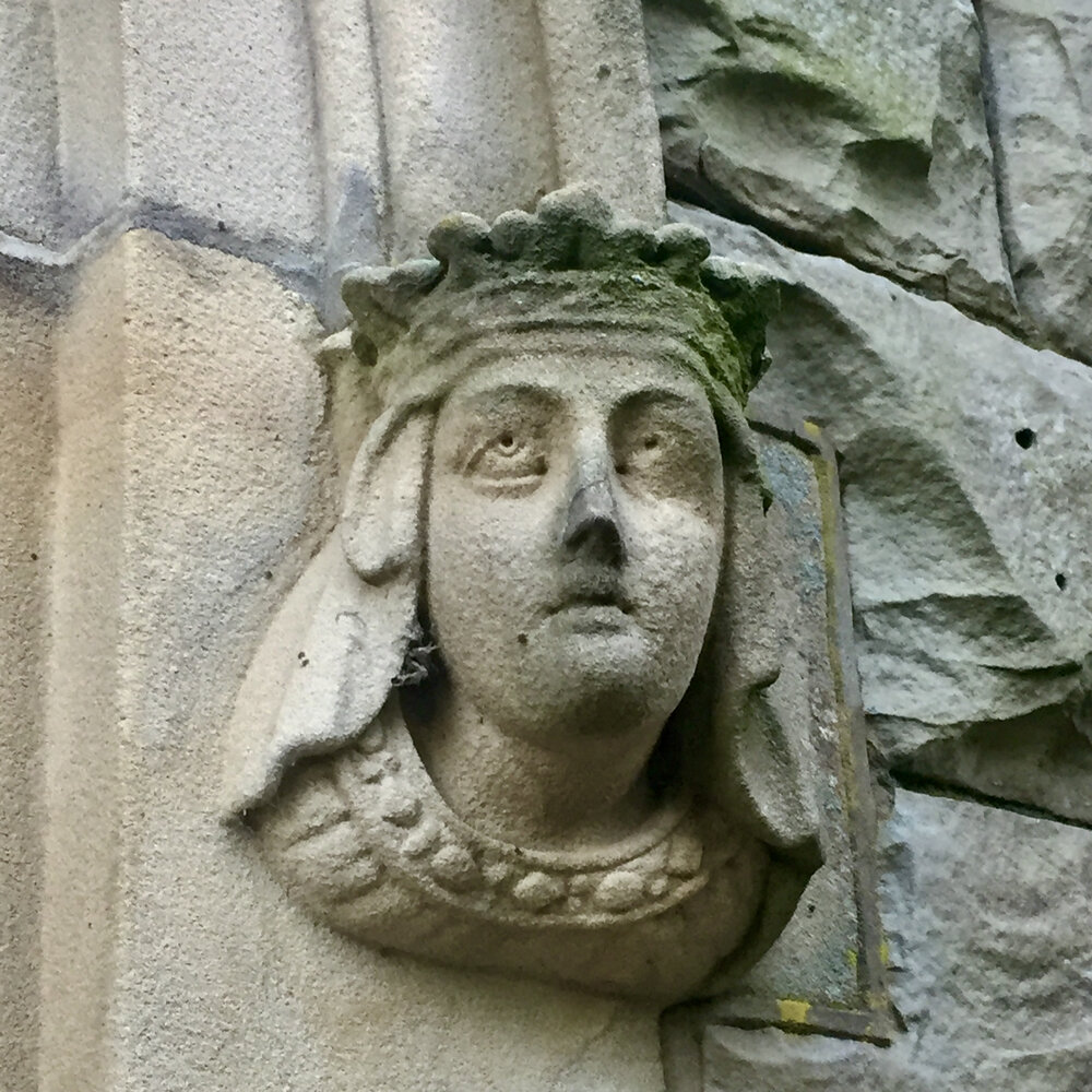  A stone head from one side of the main entrance: it looks like a crowned lady, and she’s looking upwards as if in annoyance. 
