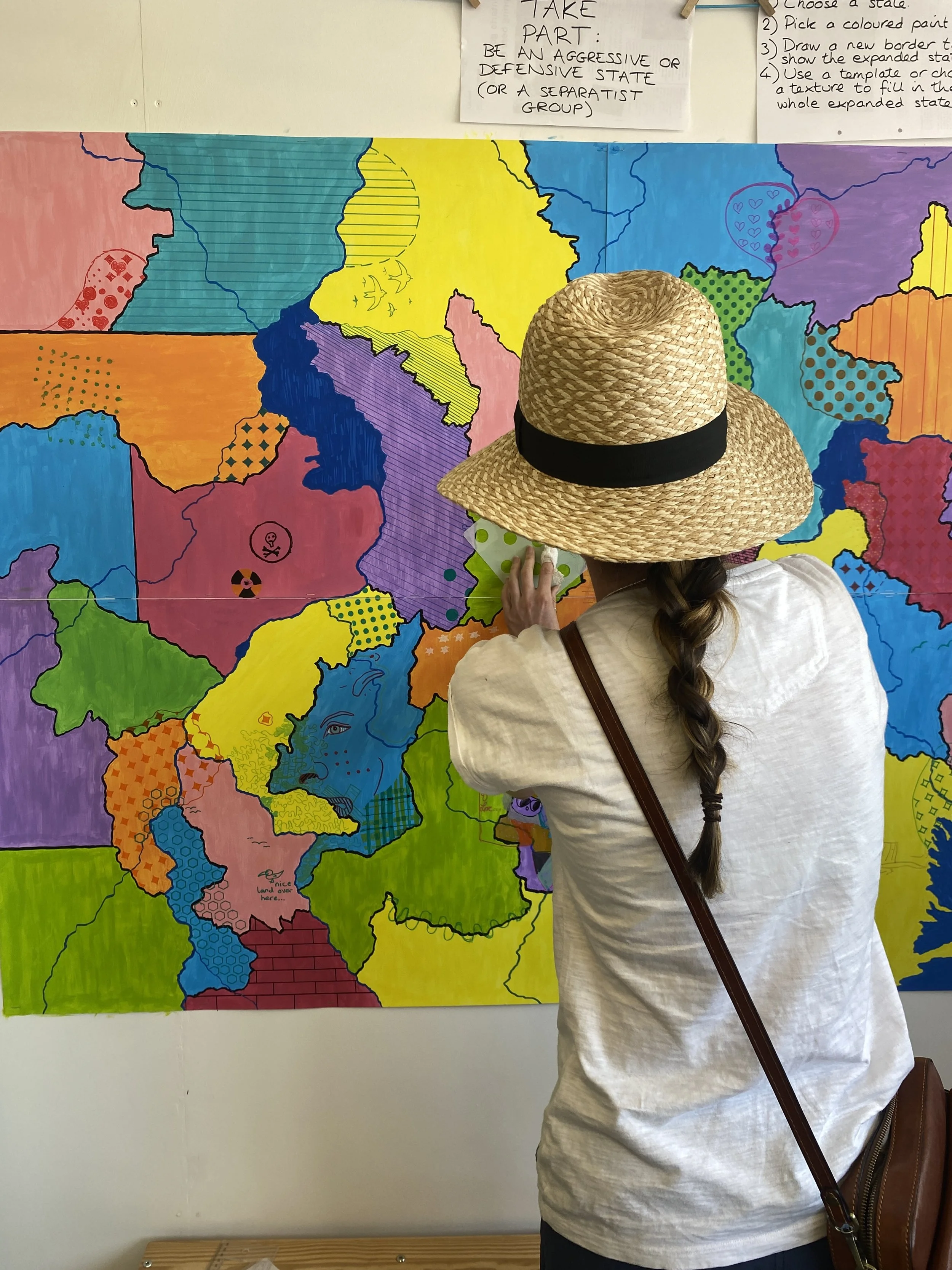  A woman adds more patterns. 