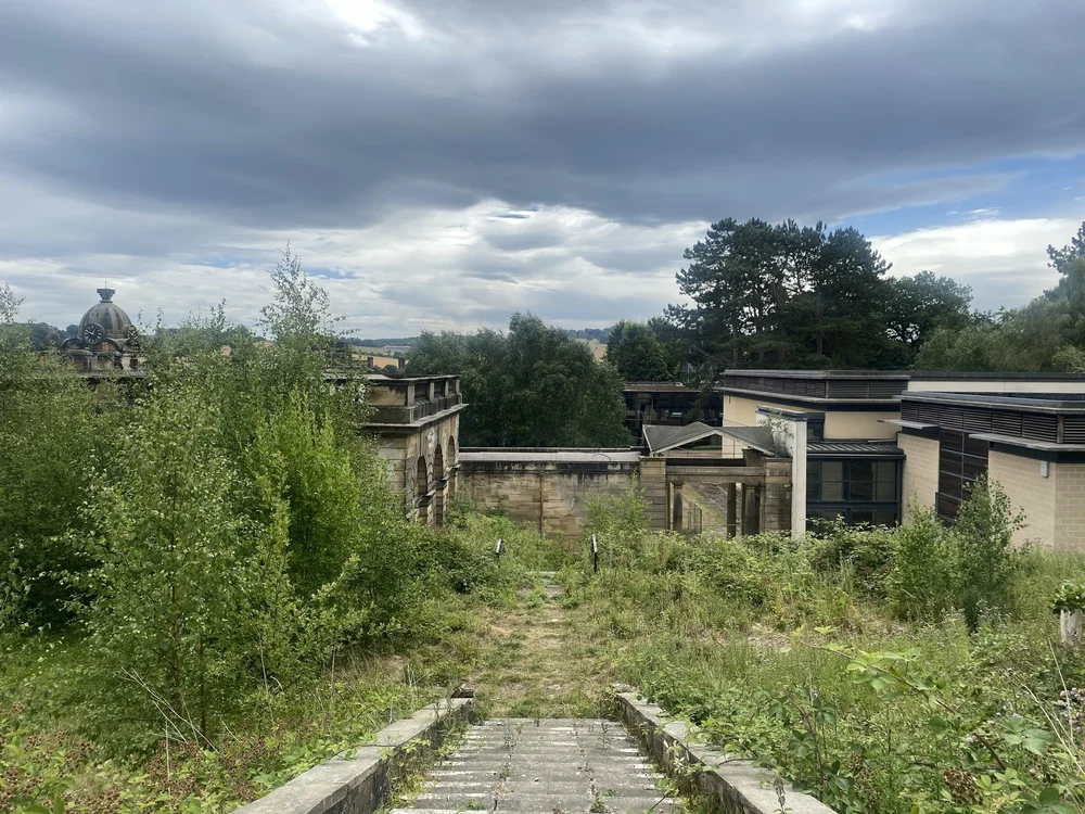  The view of the college buildings and the landscape beyond from the top of the second flight of steps. 