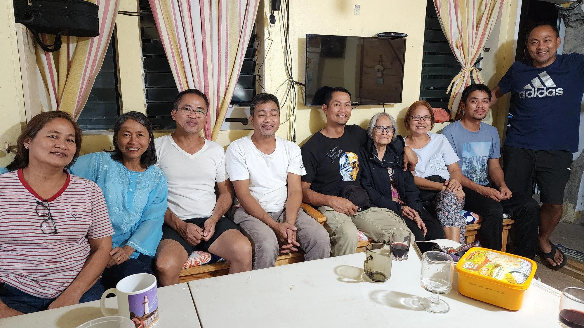 Malou (2nd from left) with her mother, Mama Letty, and two sisters plus five of her eight brothers