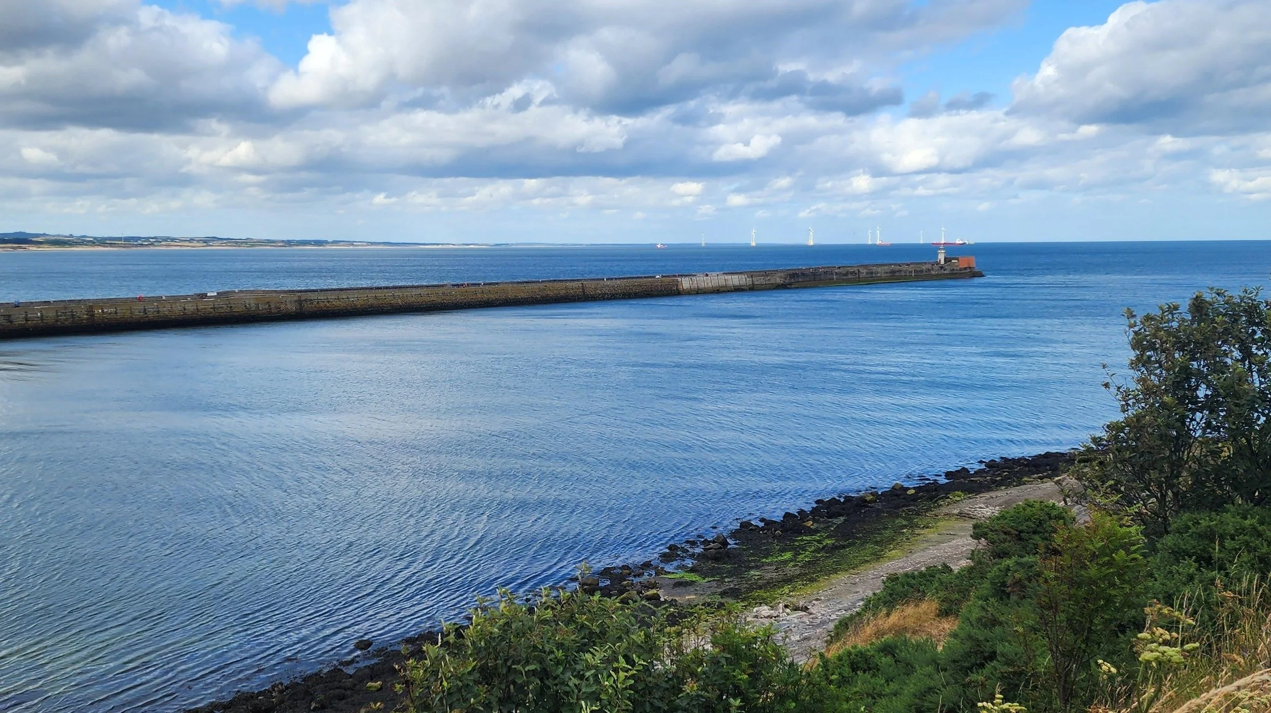 A pier from Aberdeen harbour stretching out into the North Sea