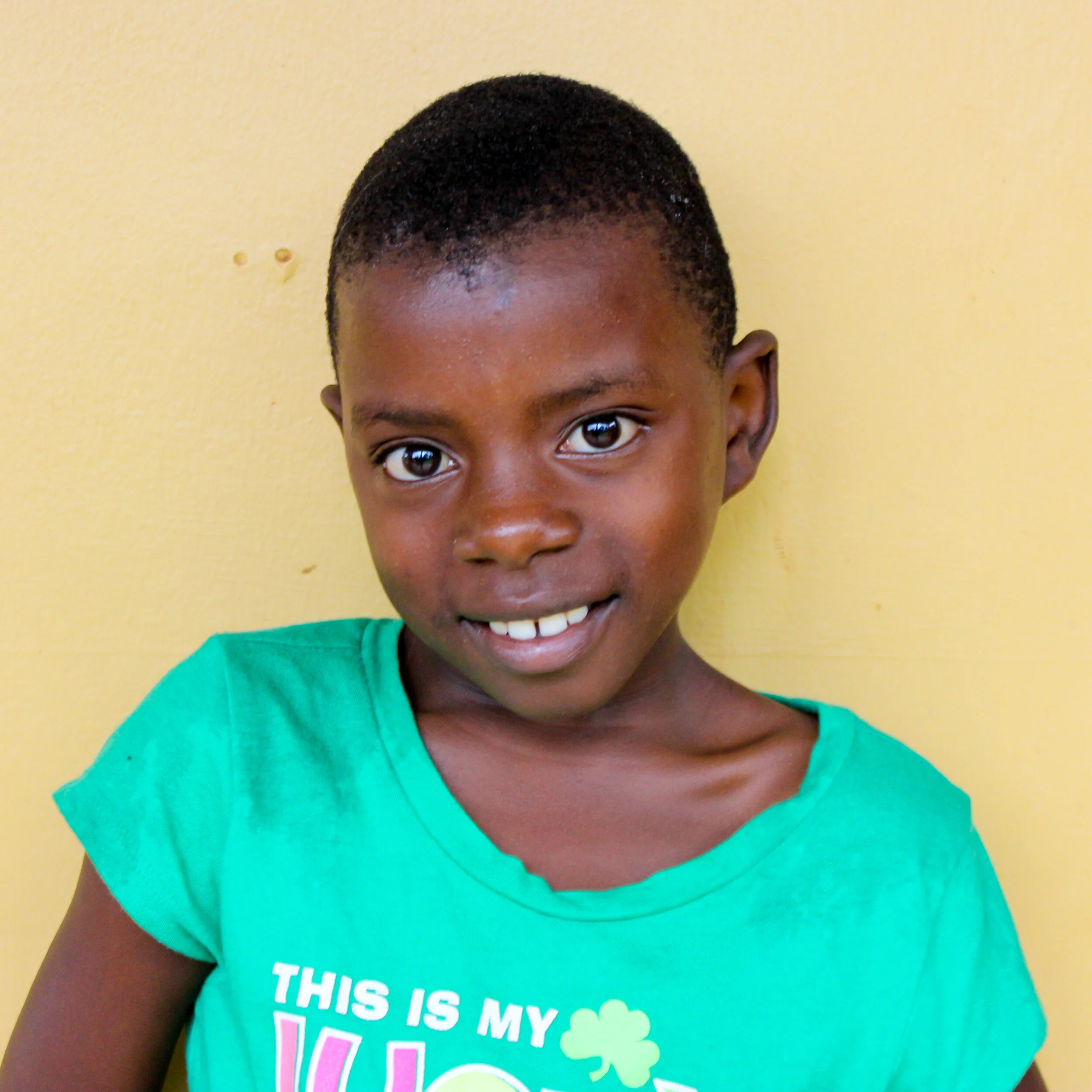 Young orphan with green t-shirt