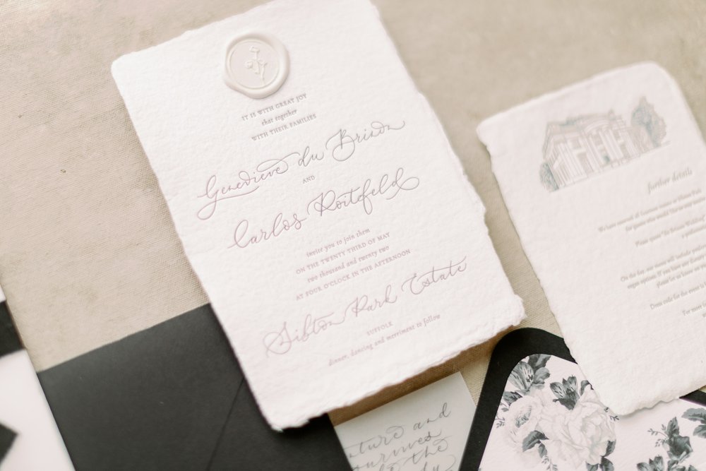 Letterpress wedding invitation with handmade paper wax seal and calligraphy names