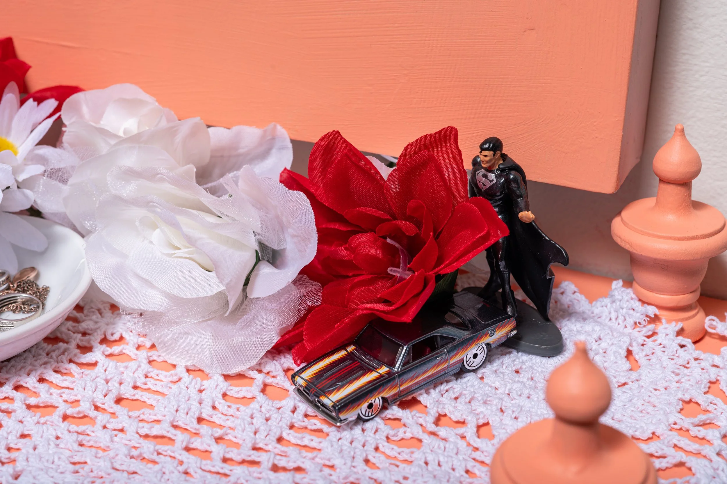 Detail of Tending To The Past iii, mixed media work on paper with shelf, mirror,dove,toy cars, candle, jewelry and flowers, 2023