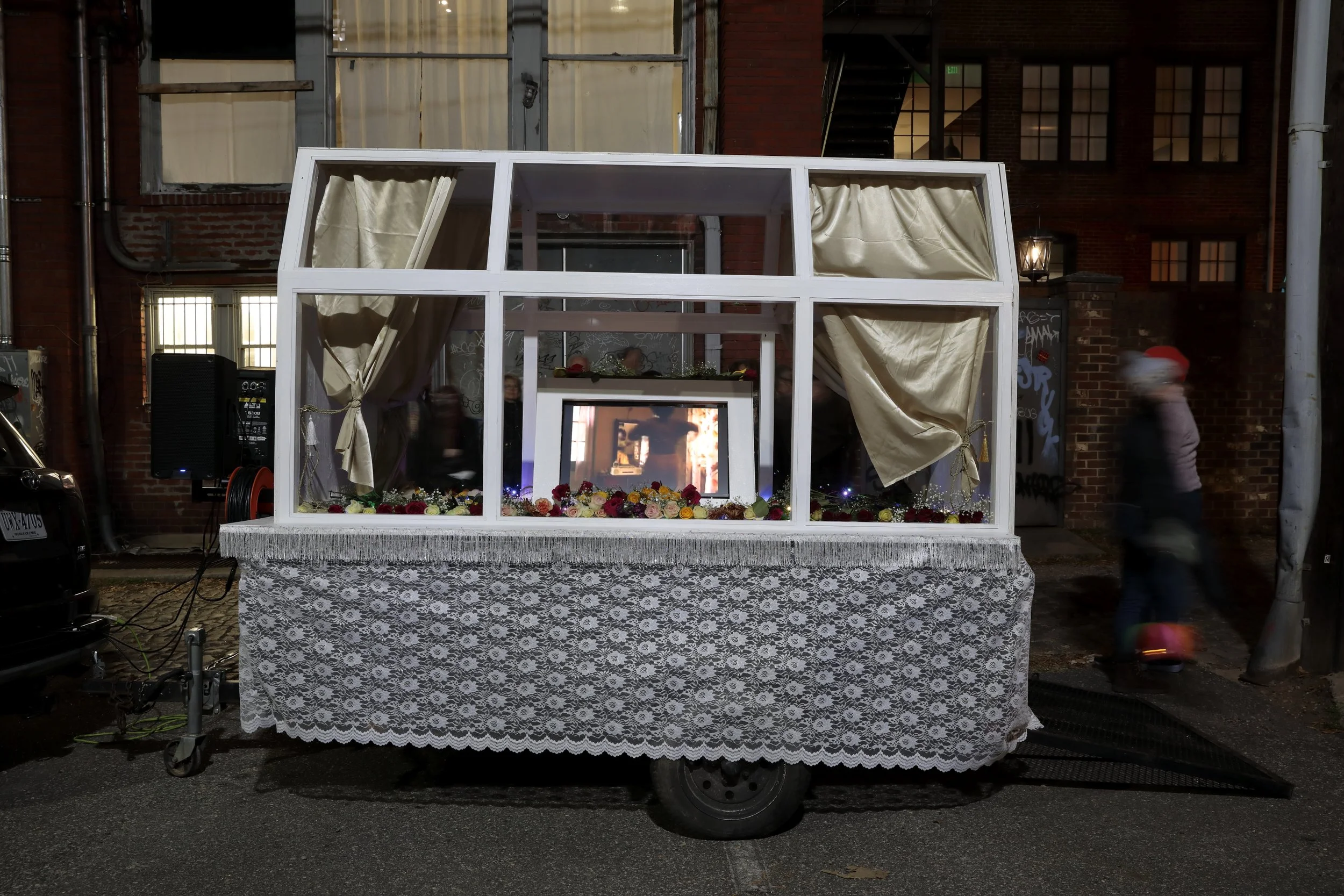 Together, We Gather (Give me Liberty or Give me Death) 2023, trailer, wood, flowers, SUV, speakers, and video