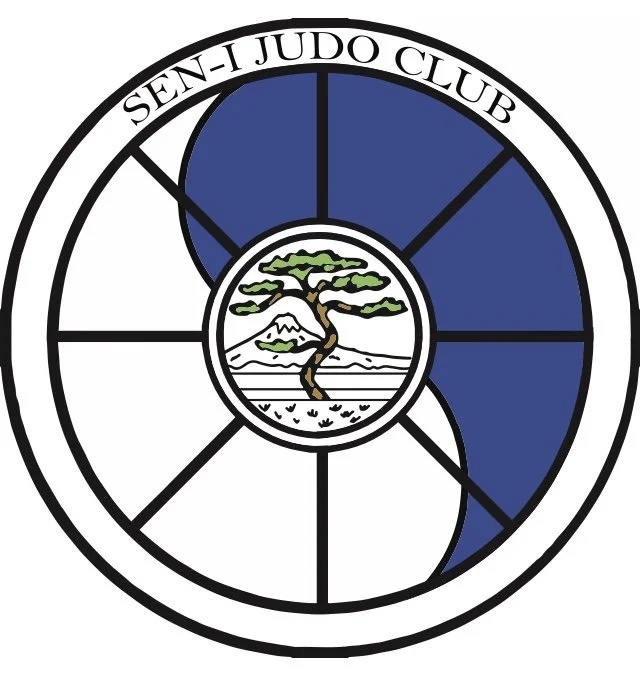Logo of Sen-I Judo Club featuring a central illustration of a pine tree, a mountain, and a body of water, surrounded by a circular border with the club's name, and a design resembling a stylized judo belt.