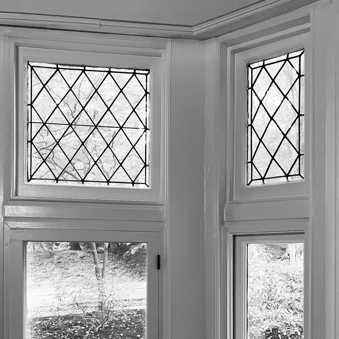 Something about original leaded glass windows.  They are even more magical when they are in a diamond pattern. These were originally installed in 1903 and still look every bit amazing as they did on the first day.  All of those original moldings cert