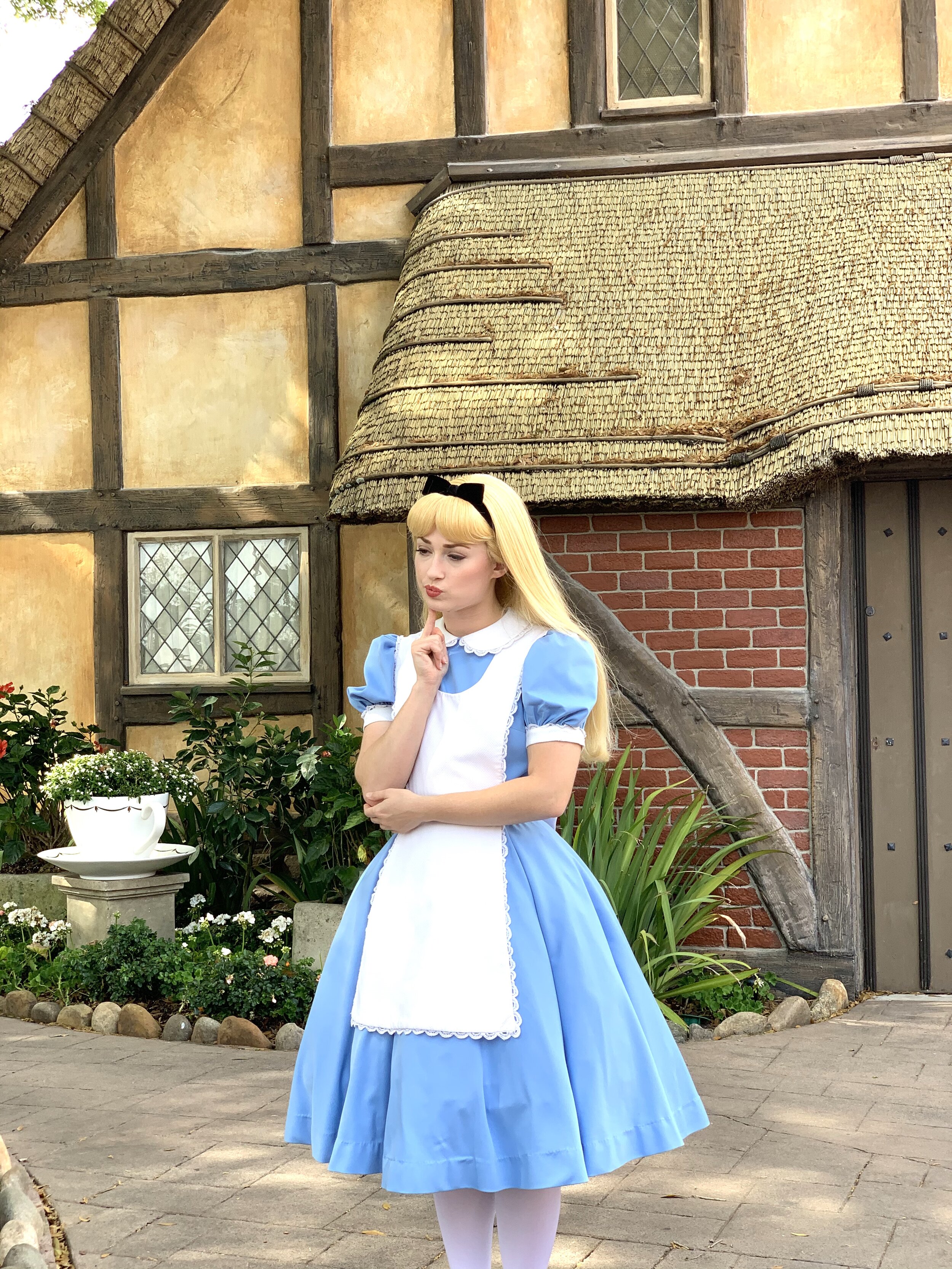  I was mesmerized by the way Alice stayed in character as she posed for pictures and interacted with the kids and adults at Epcot. Here, she thoughtfully considers her answer before answering a child’s question. 