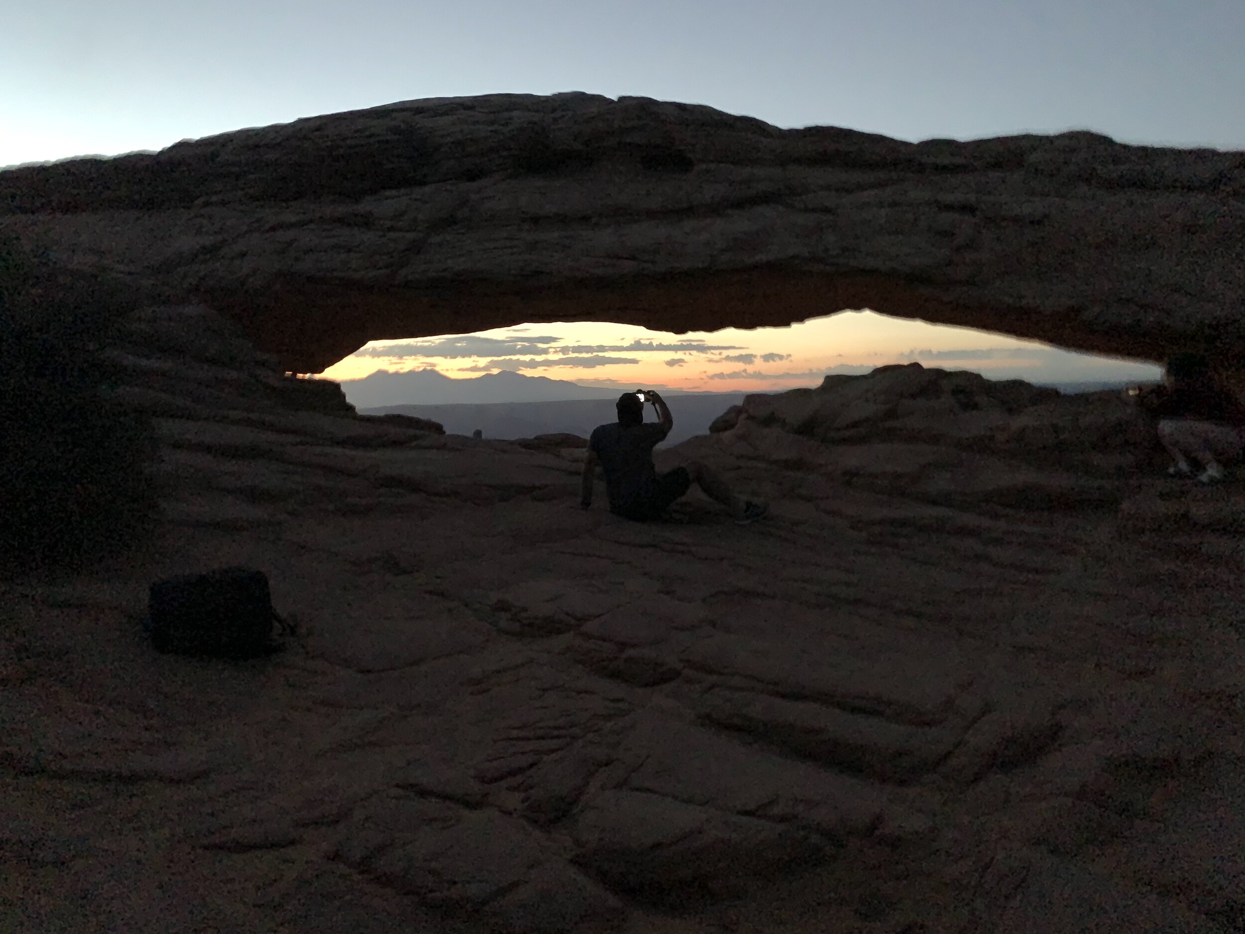  This morning we set out at 4 am for sunrise pictures of Mesa Arch in Canyonlands. Craig was there in plenty of time to set up his camera. Clay and I tried to sleep beside a rock as we waited.😴 