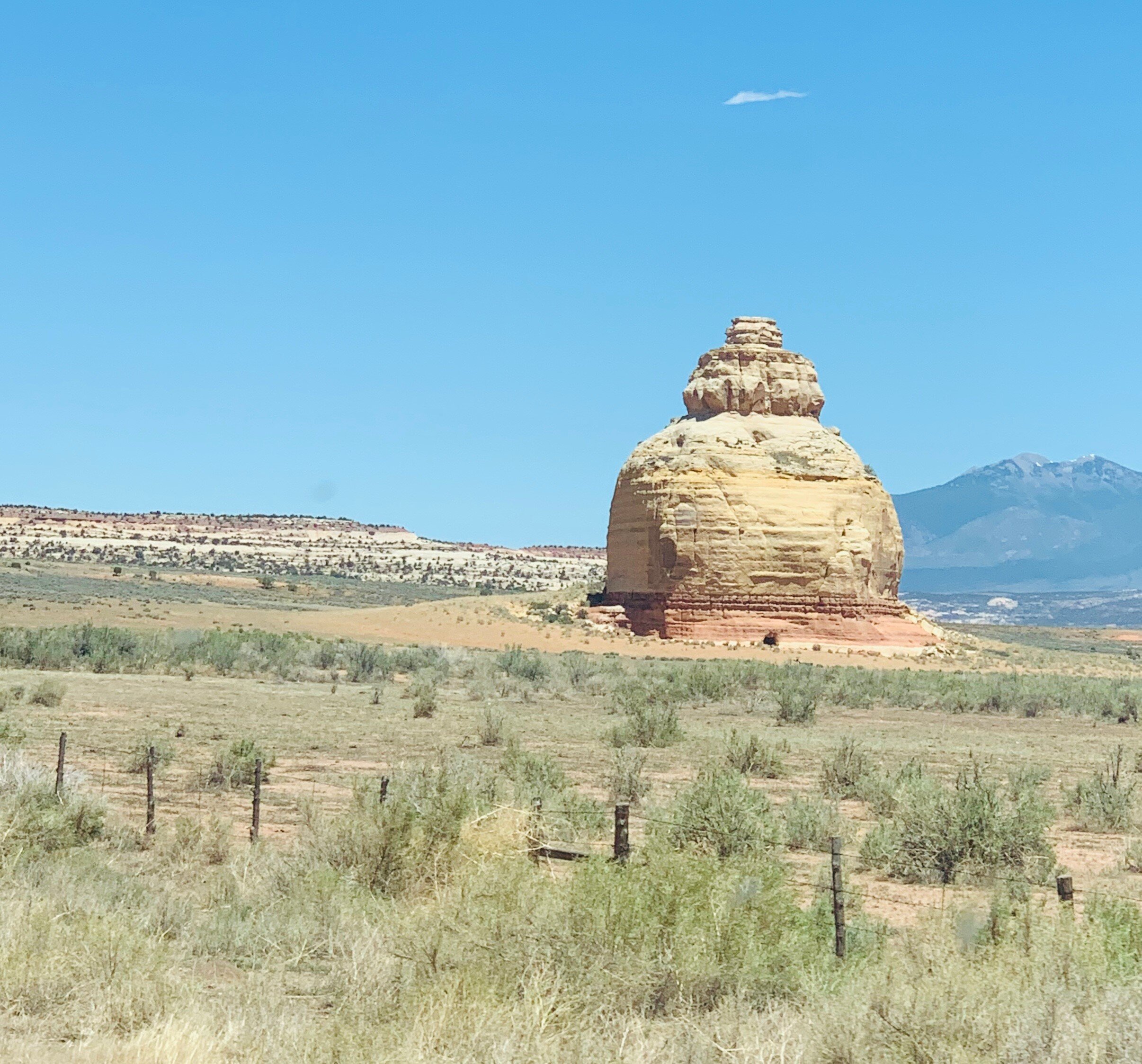 On the way to Moab, UT, we spotted this lone rock near Monticello. As it is named,  Church Rock  carries rumors of getting its name from a zealous religious woman with a colorful history, who came into the area in the 1930s and wanted the rock made 