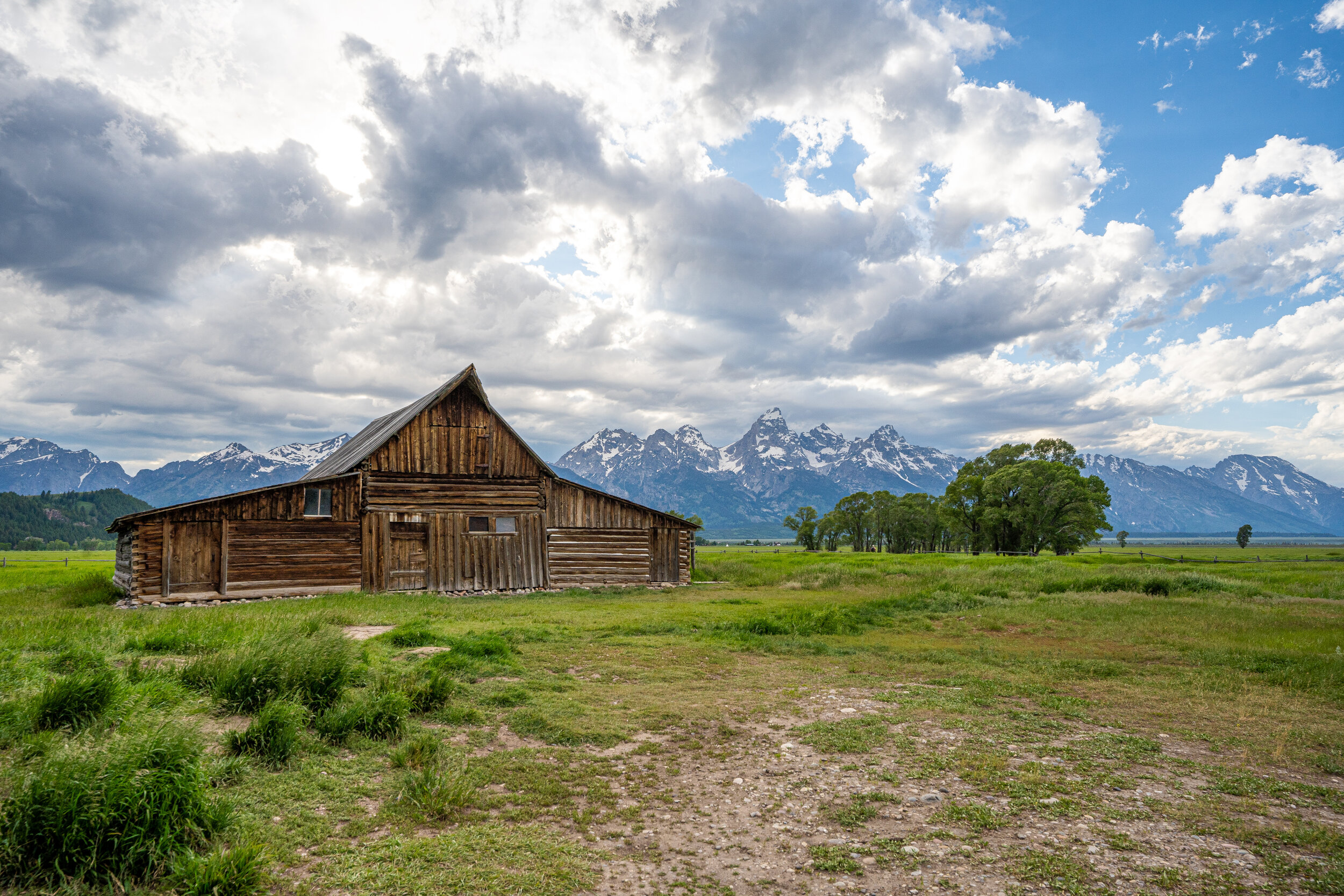  The most well-known of all the structures on Mormon Row is the famous T.A. Moulton Barn. You’ve probably seen a framed photograph or painting or completed a 1000-piece puzzle of this famous barn with the Teton Range in the background.  