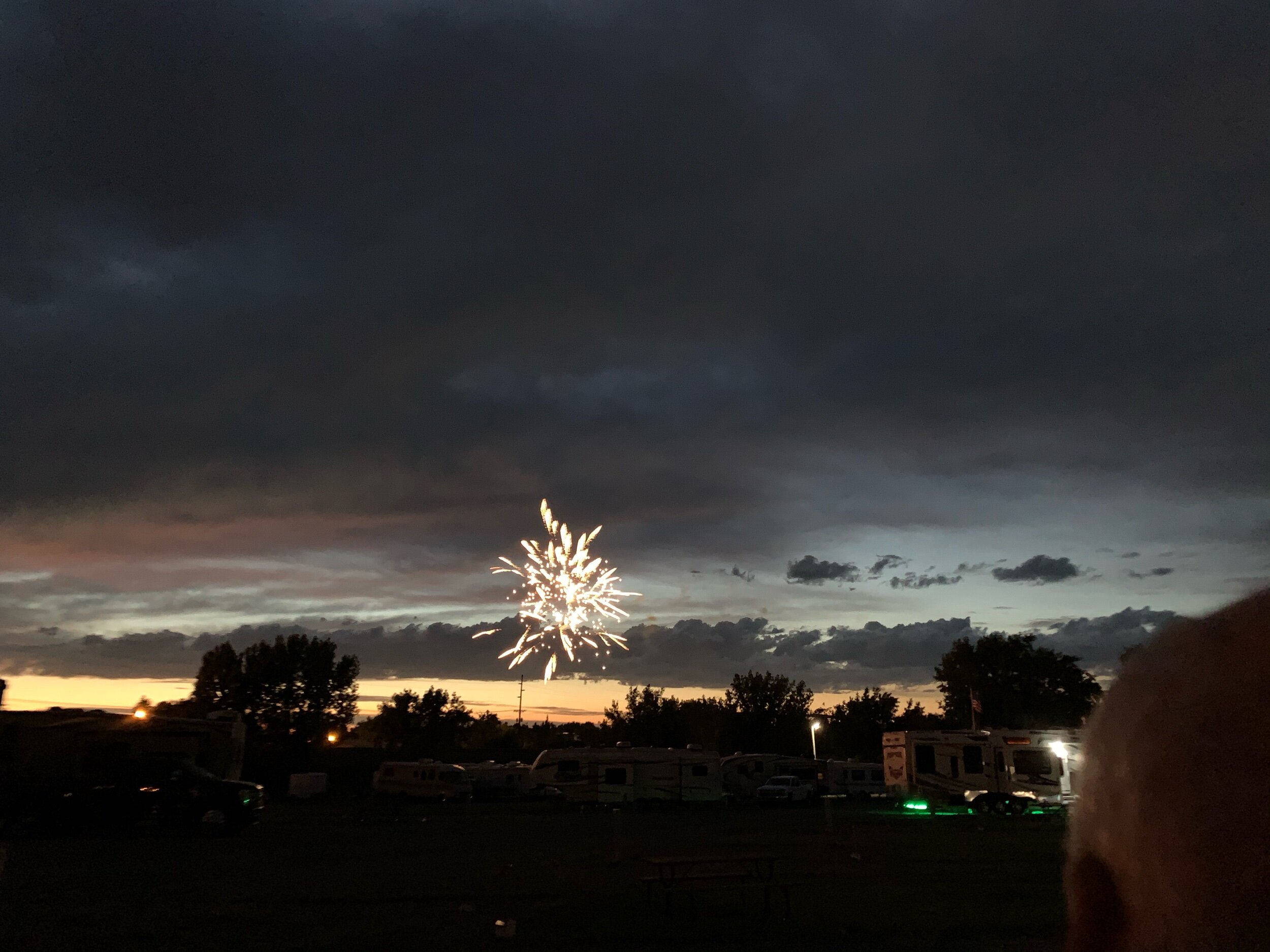  It was unusual for us to sit in jackets and blankets on July 4th to watch fireworks. It also does not get completely dark out here until around 10:20 pm, so the fireworks were done while it was still partially daylight. This picture was taken at 10 