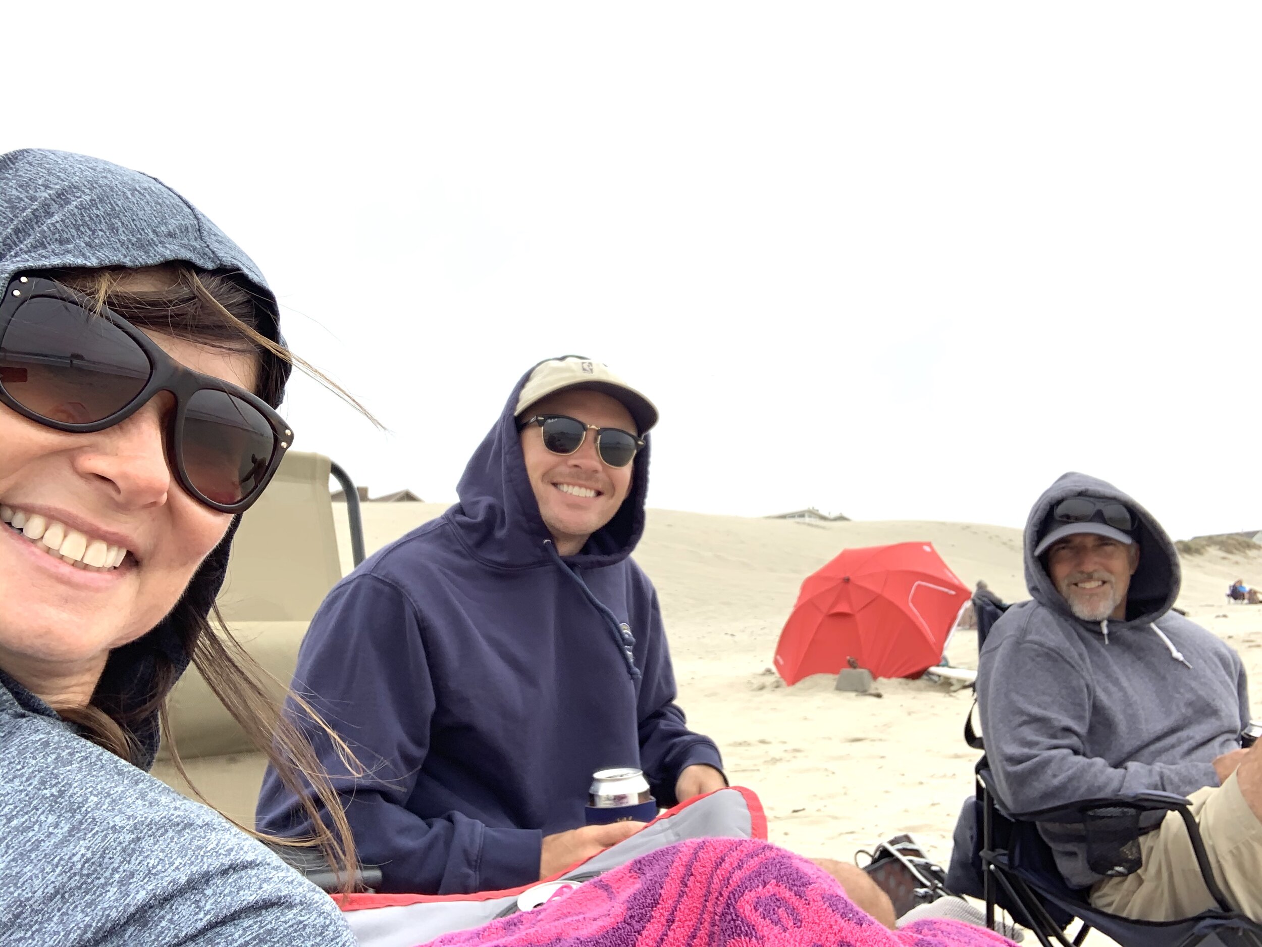  Since Cannon Beach was surprisingly warm, we assumed  Pacific City Beach,  about 75 miles south, would be as well. It was not.  We were pretty cold but determined a beach day is a beach day, and as we say,  "A freezing day at the beach is better tha