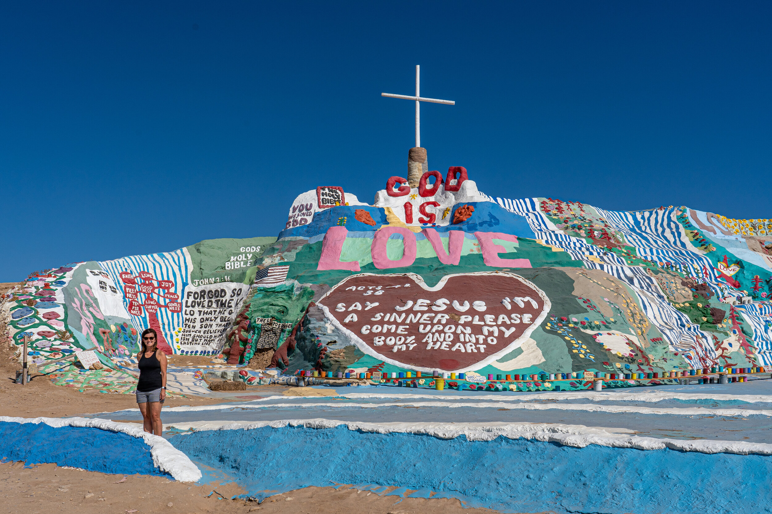  One person described  Salvation Mountain   as "Candy Land meets Vacation Bible School."  This mound of mud, hay, and over a million gallons of donated paint was a 28-year long project of Leonard Knight, the man who settled here and began to work on 