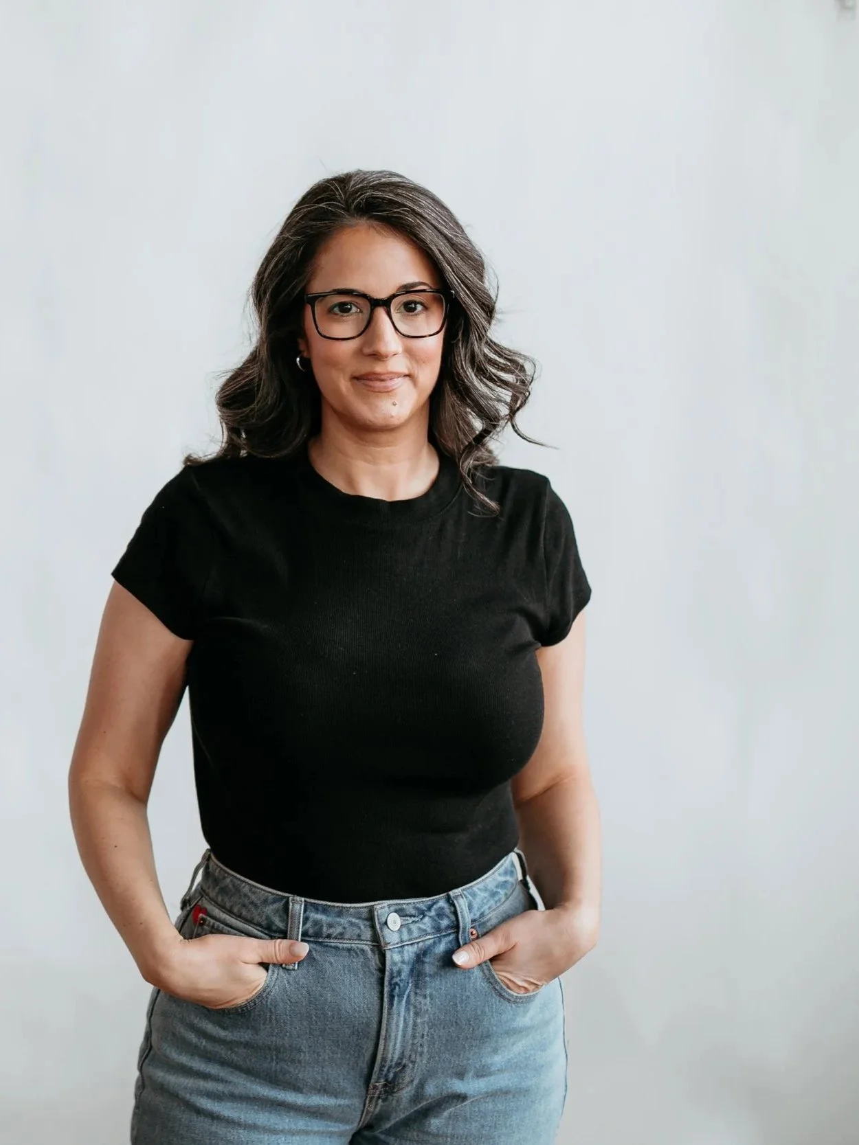 Image of Sara Farrell in a black tshirt and jeans