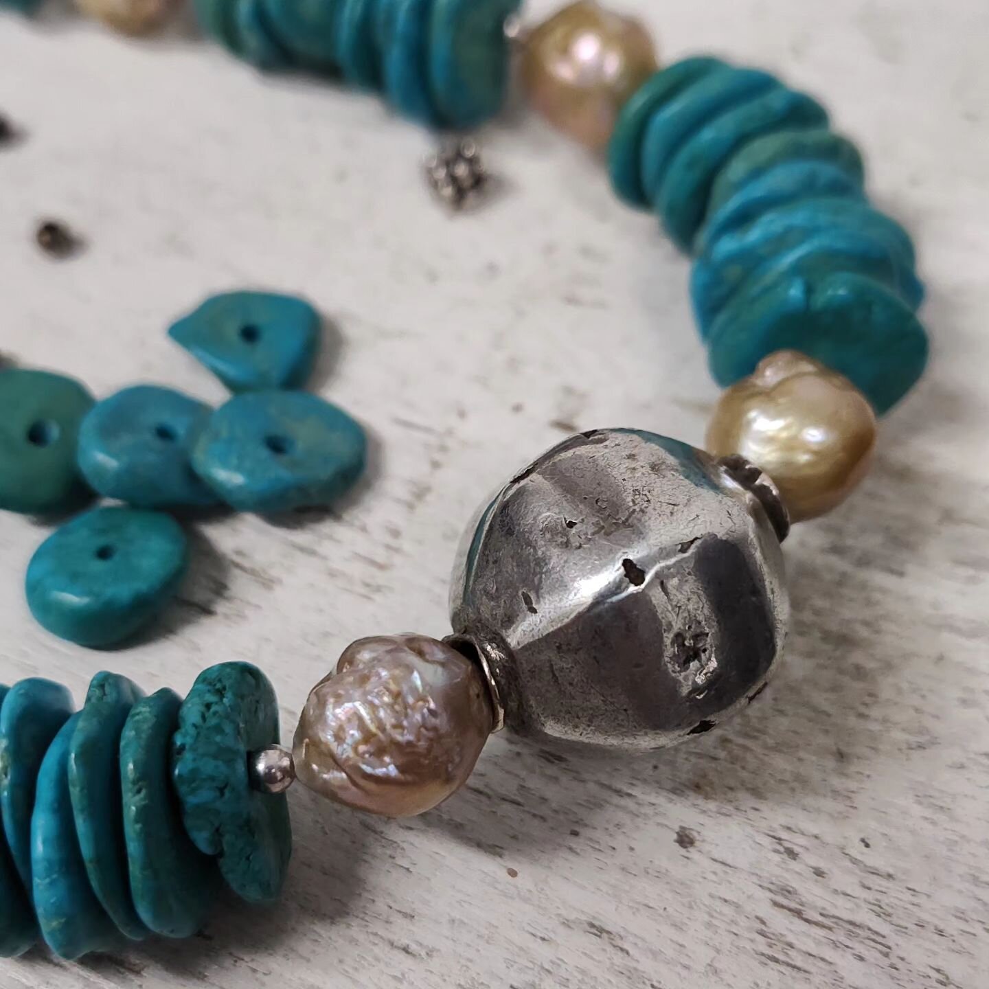 🌷 Working on something different today. Turquoise chips, baroque pearls and a large vintage silver African bead that's at least a hundred years old. The man that I purchased these beads from said they've been in his family for a long time. I told hi