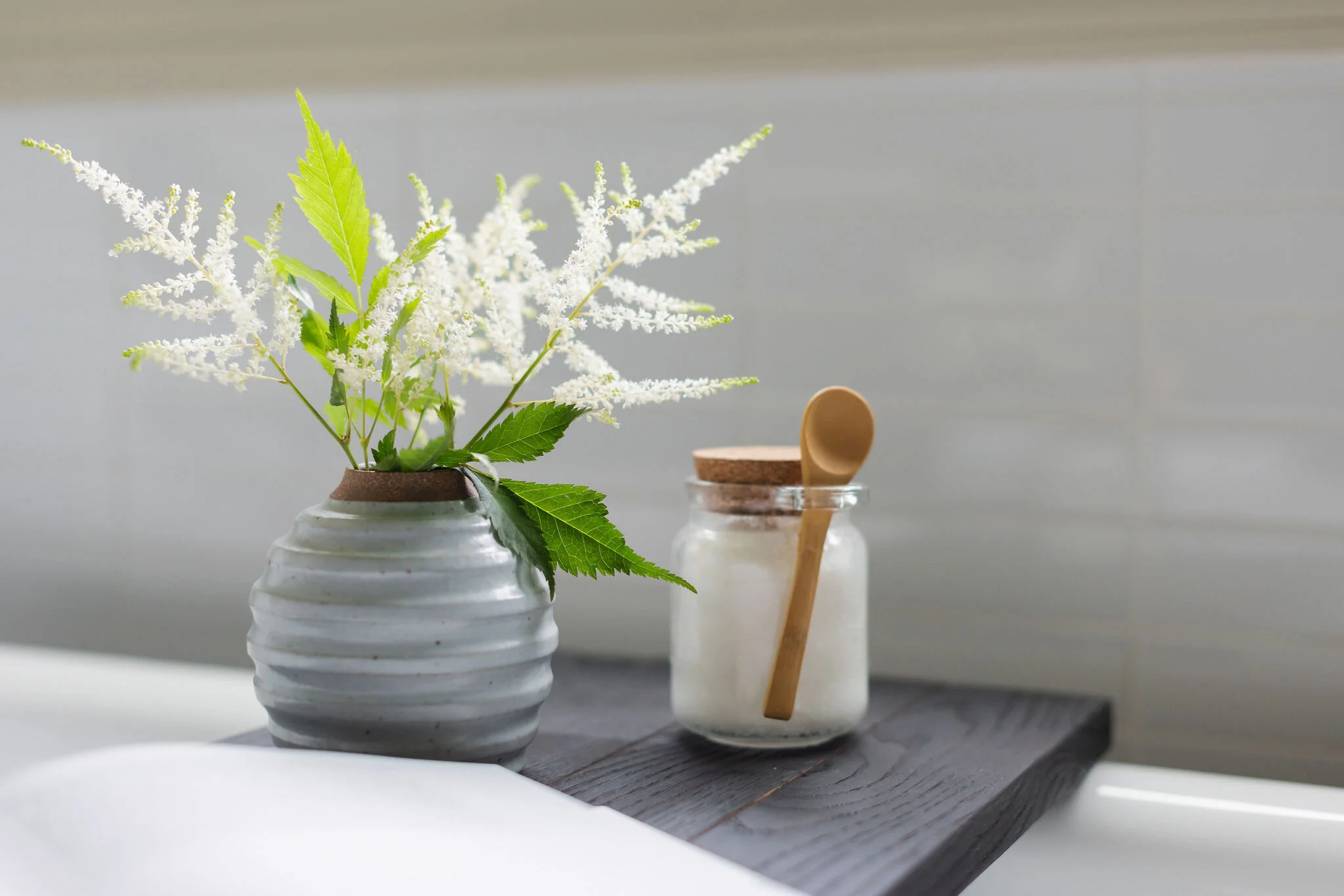 Bathroom tub caddy styling by Lauren DeBello Interiors