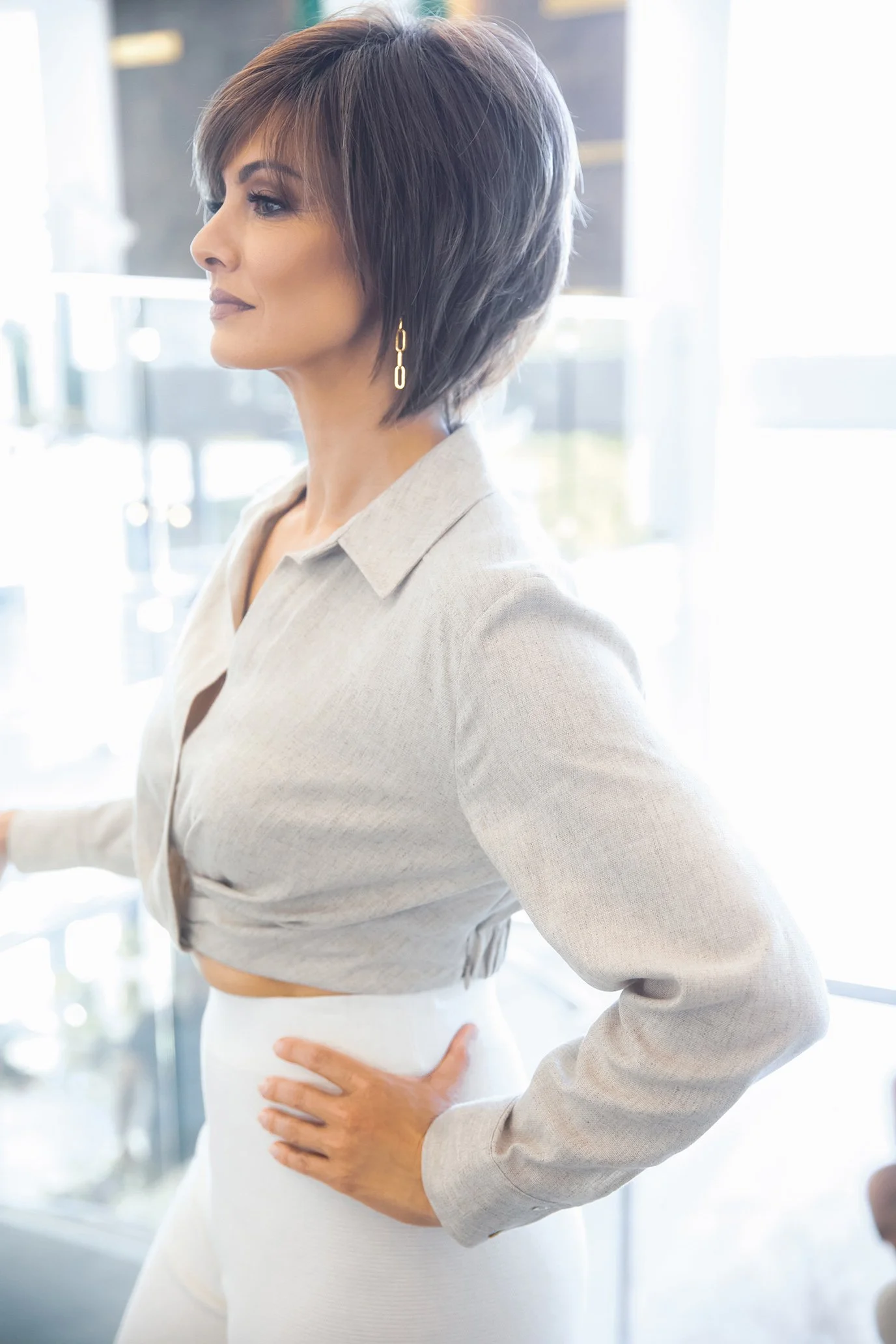 a woman standing looking away from the camera