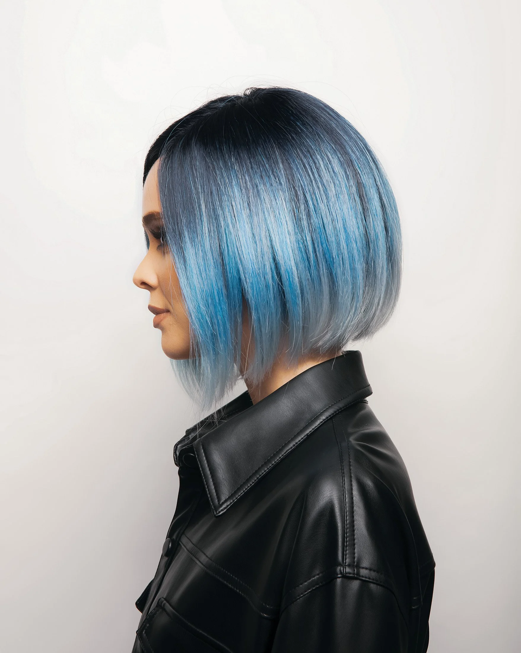 sideview of a woman wearing the Kai wig by Rene of paris