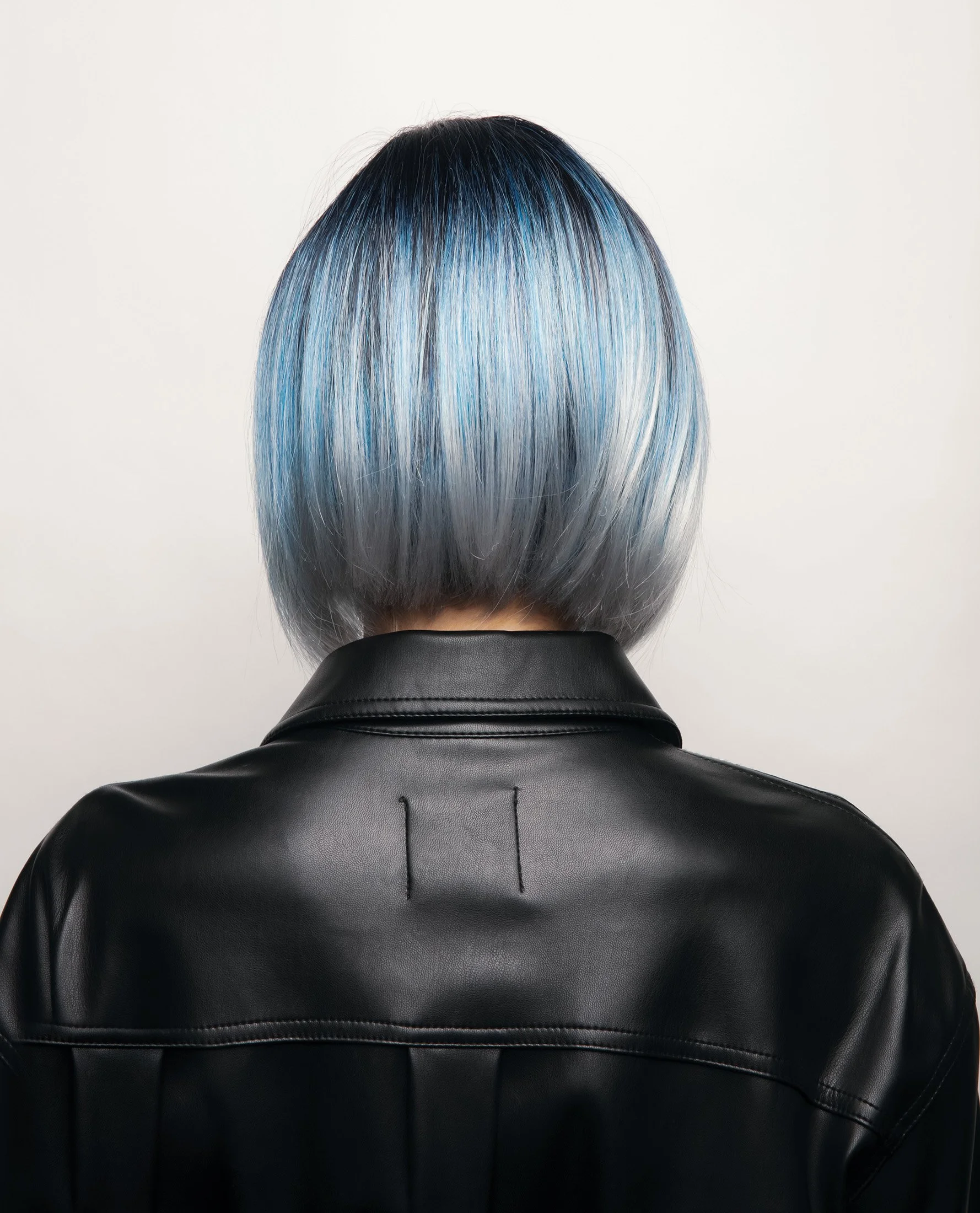 back view of a model wearing the Kai wig by Rene of paris