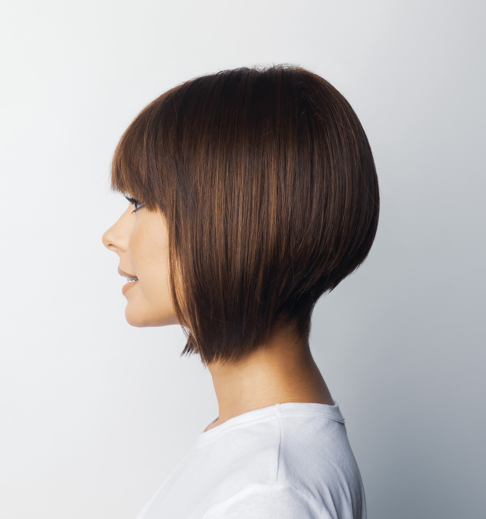 sideview of a woman wearing the Tori wig by Rene of Paris