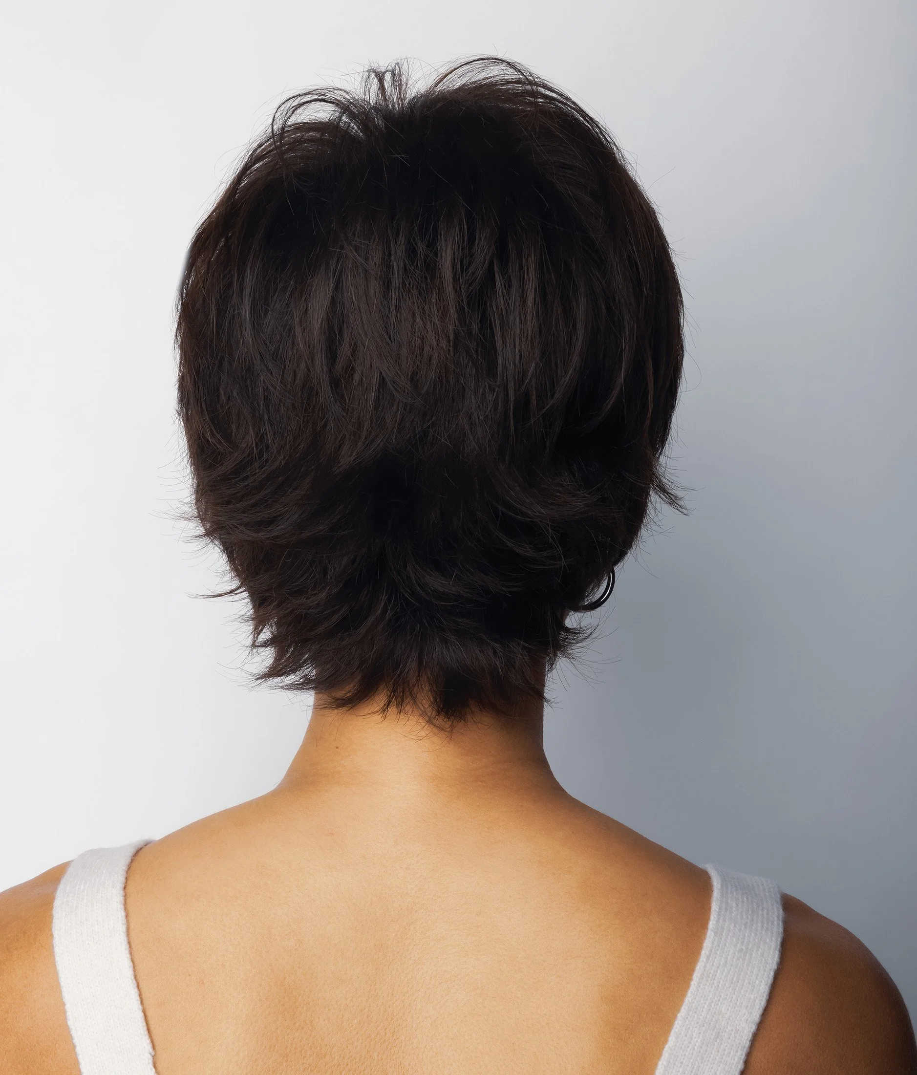 back view of a model wearing the Coco wig by Rene of Paris